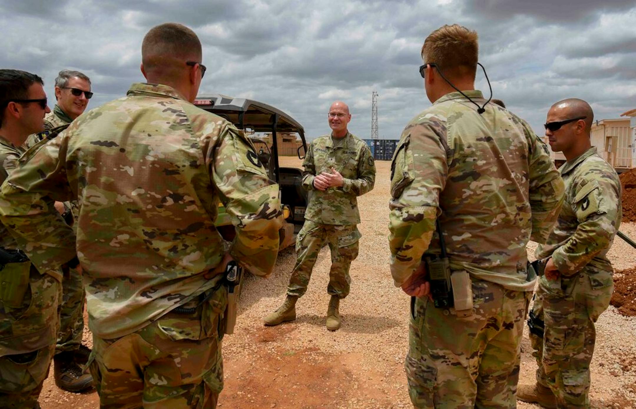 U.S. Army Brig. Gen. Damian T. Donahoe, deputy commanding general, Combined Joint Task Force - Horn of Africa, center, talks with service members during a battlefield circulation Saturday, Sept. 5, 2020, in Somalia. No country has been involved in Somalia's future as much as the United States but now the Trump administration is thinking of withdrawing the several hundred U.S. military troops from the nation at what some experts call the worst possible time.