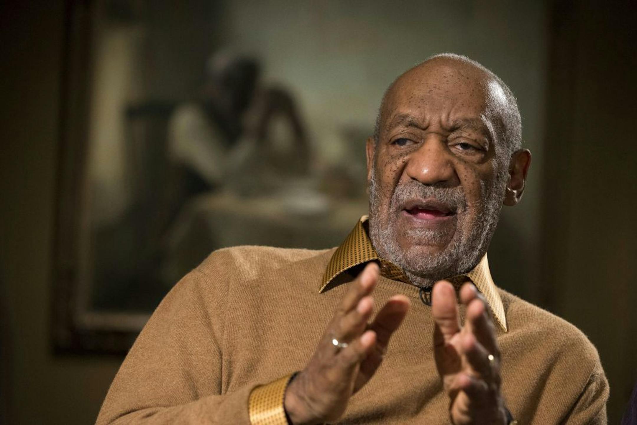 FILE - In this Nov. 6, 2014 file photo, entertainer Bill Cosby gestures during an interview at the Smithsonian's National Museum of African Art in Washington.
