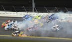 Martin Truex Jr. (78), Greg Biffle (16), Jimmie Johnson (48) and Jamie McMurray (1) are at the head of a multi-car accident between Turns 1 and 2 at D