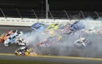 Martin Truex Jr. (78), Greg Biffle (16), Jimmie Johnson (48) and Jamie McMurray (1) are at the head of a multi-car accident between Turns 1 and 2 at D