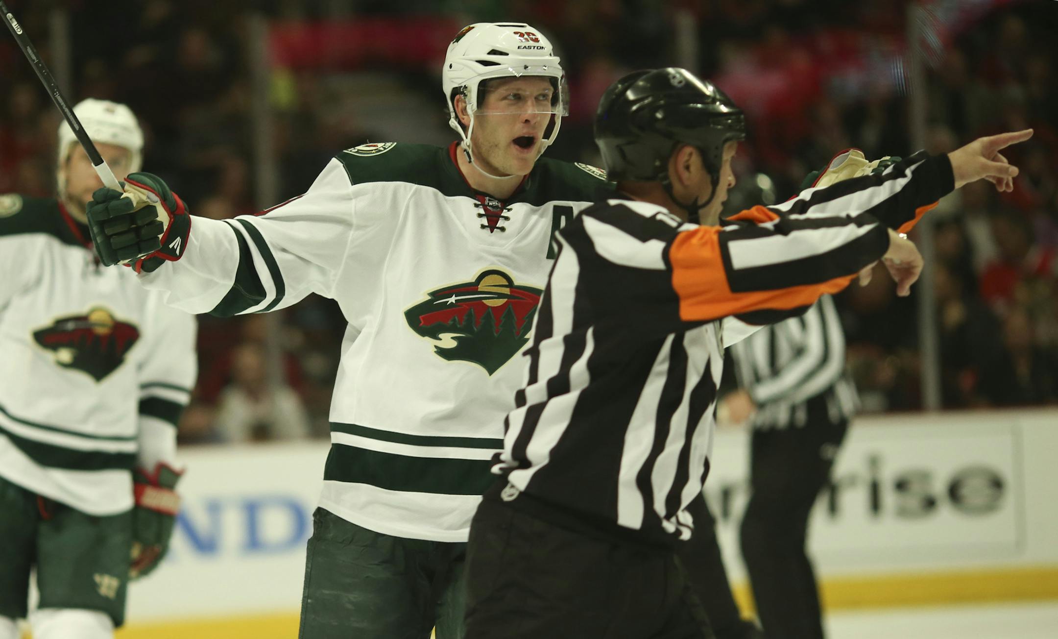 Minnesota Wild defenseman Ryan Suter (20) argued a second period penalty call for too many men on the ice with referee Kelly Sutherland Friday night at United Center in Chicago. ] JEFF WHEELER ï jeff.wheeler@startribune.com The Minnesota Wild began their NHL second round playoff series against the Chicago Blackhawks Friday night, May 2, 2014, at United Center in Chicago. ORG XMIT: MIN1405022246384625