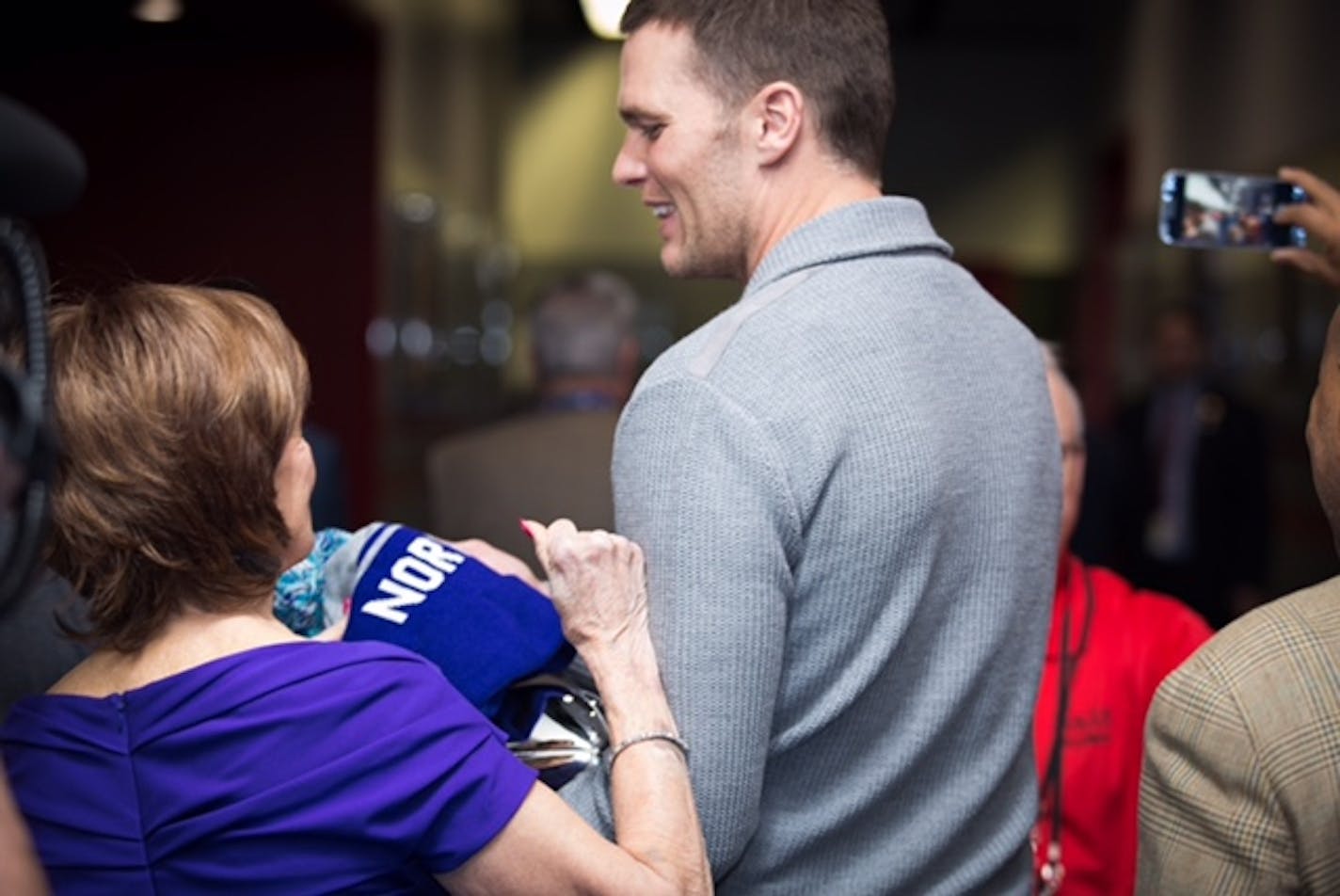 Photo by Uzoma Obasi
Minnesota host committee co-chair Marilyn Carlson Nelson and Patriots' Tom Brady