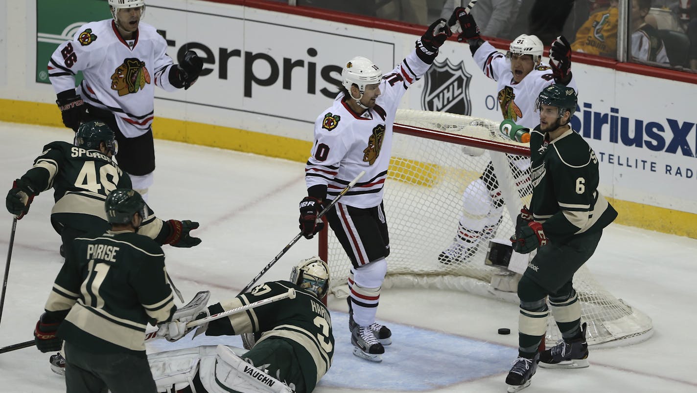 Patrick Sharp celebrated with teammate Marian Hossa as the Blackhawks scored in the first period of Minnesota goal keeper Niklas Backstrom.The Minnesota Wild faced the Chicago Blackhawks in game four of their NHL Western Conference quarterfinal playoff series Tuesday night, May 7, 2013 at Xcel Energy Center in St. Paul, Minn. ] JEFF WHEELER &#x201a;&#xc4;&#xa2; jeff.wheeler@startribune.com