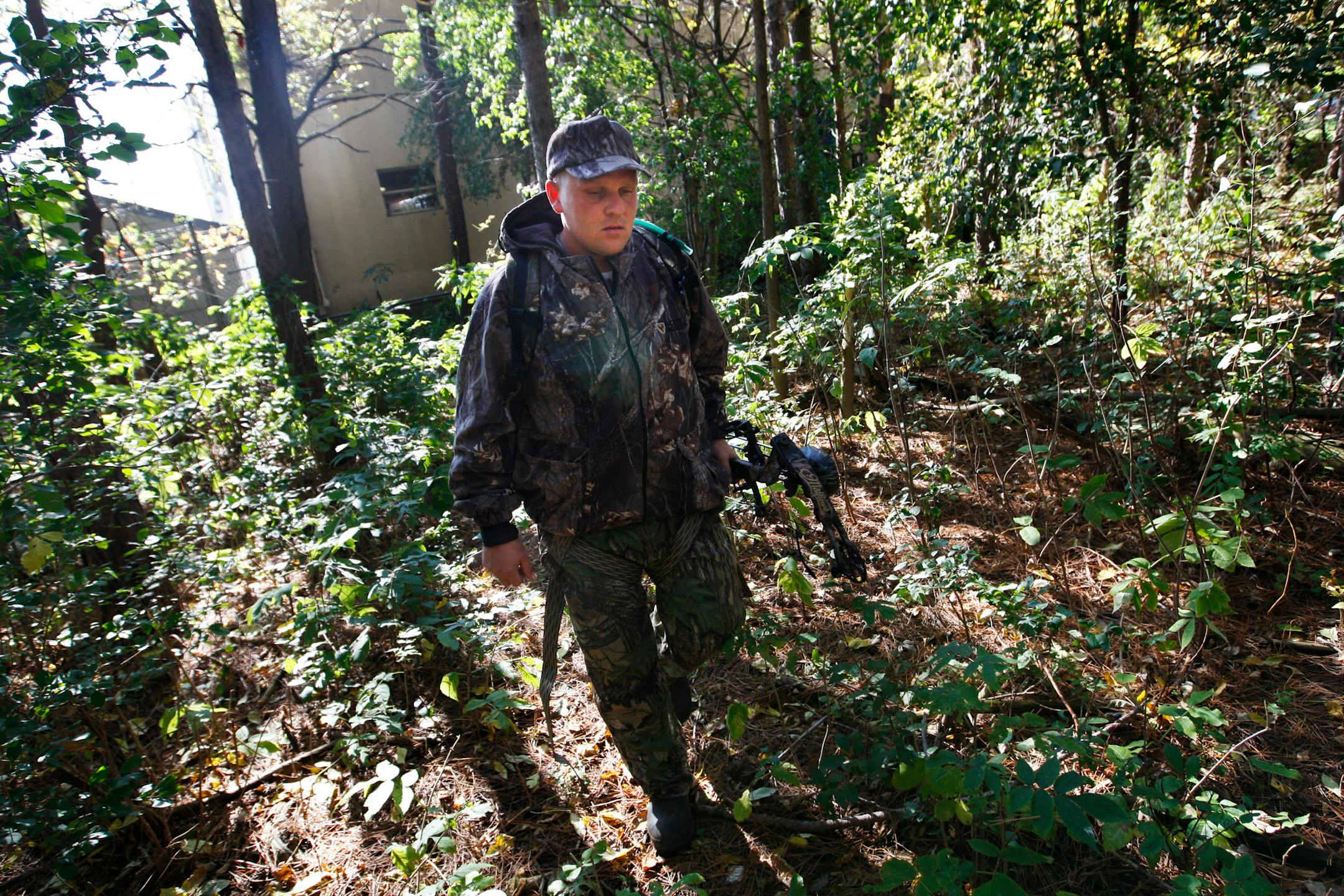 Shawn Jensen headed back to check on his deer stand.