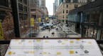 Signage in the skyway explained the renovations to Nicollet Mall as event organizers prepared for dedication ceremony to mark its opening Thursday. ] 