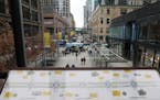 Signage in the skyway explained the renovations to Nicollet Mall as event organizers prepared for dedication ceremony to mark its opening Thursday. ] 