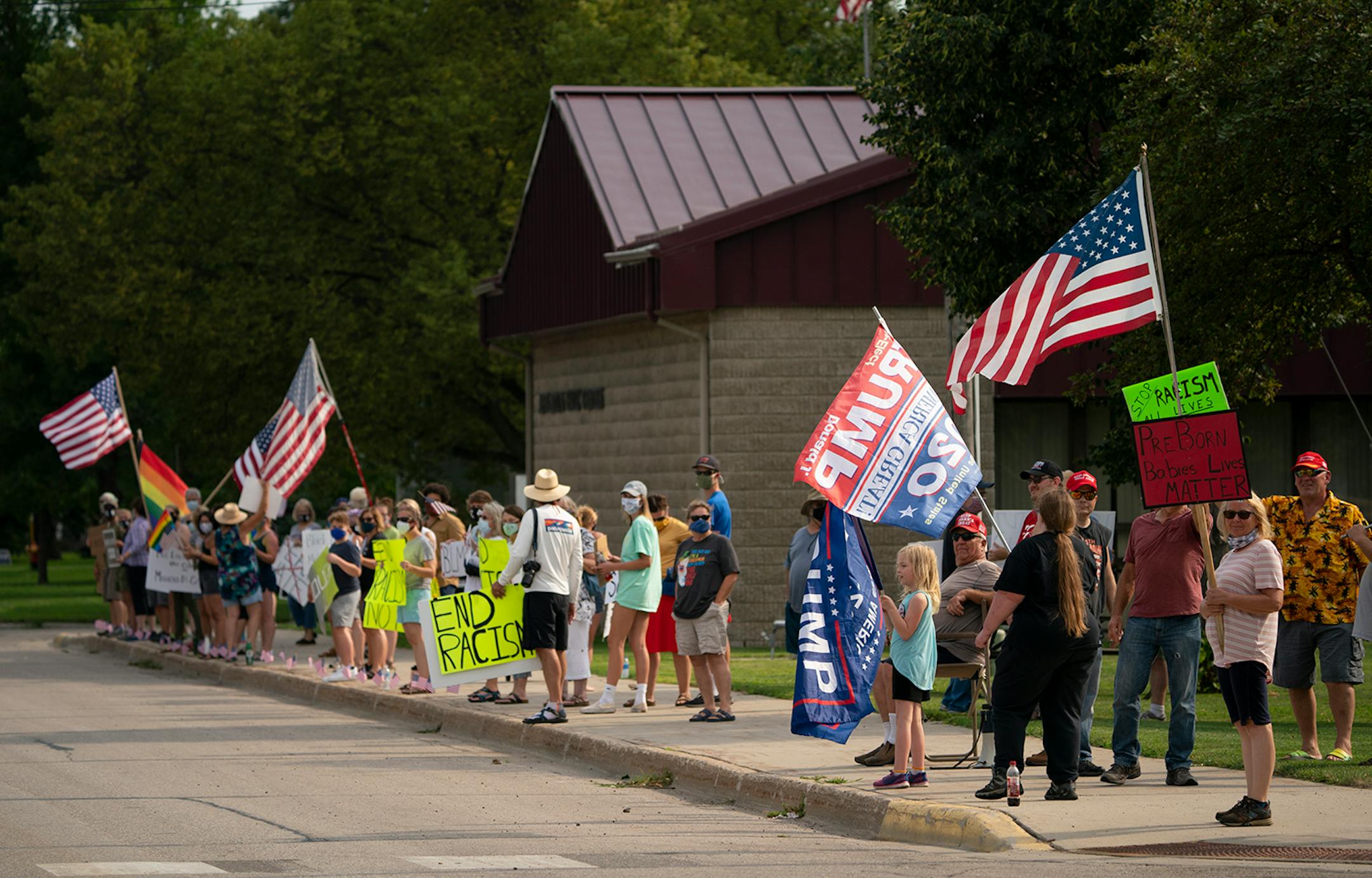 The pro-Trump demonstrators, right, were outnumbered about 3 to 1 by the 45 or so social justice supporters.