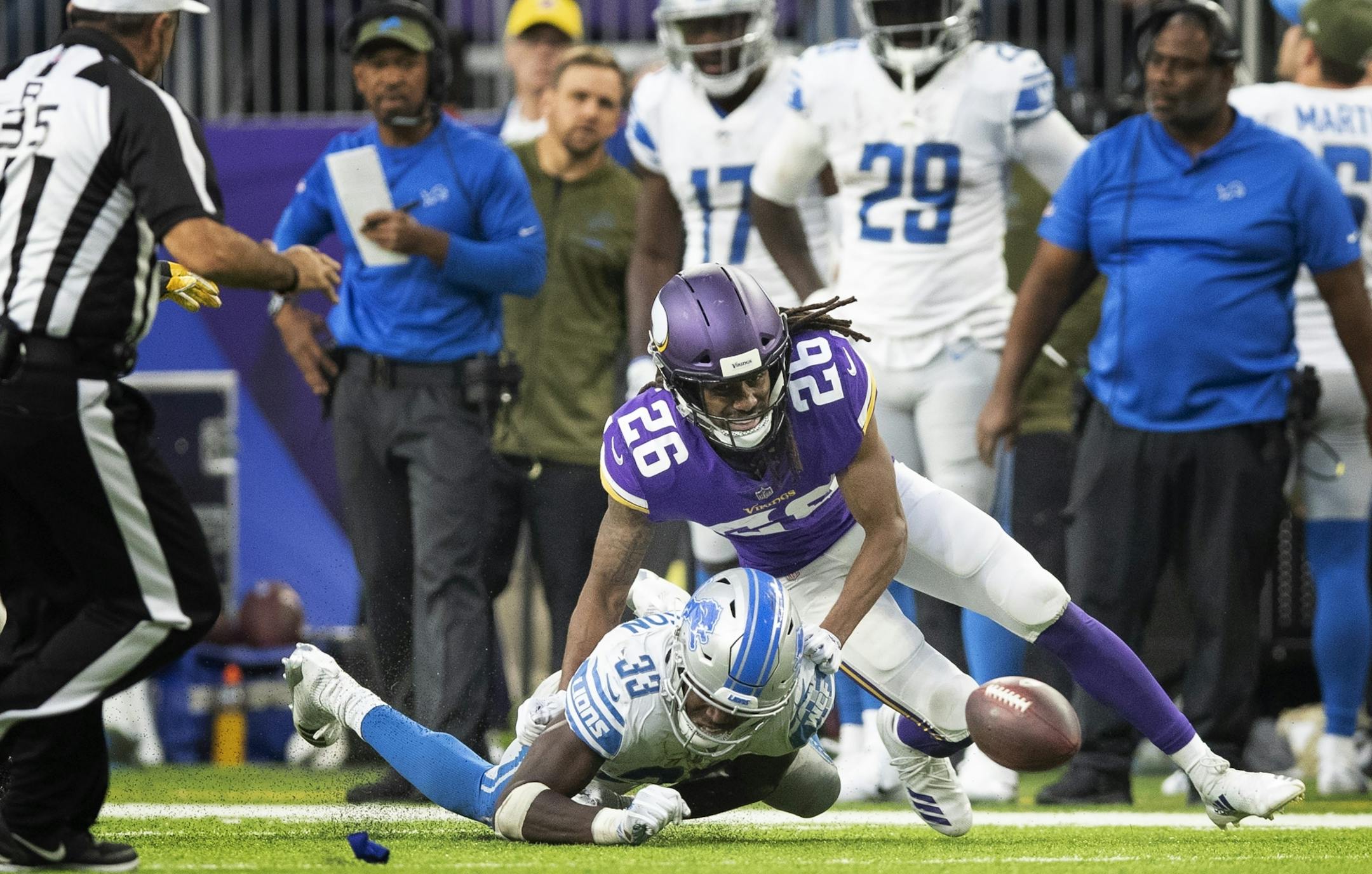 Vikings corner back Trae Waynes and Lions running back Kerryon Johnson watched the a fumble bounce on the turf in the forth quarter at U.S.Bank Stadium Sunday 4, 2018 in Minneapolis, MN.
