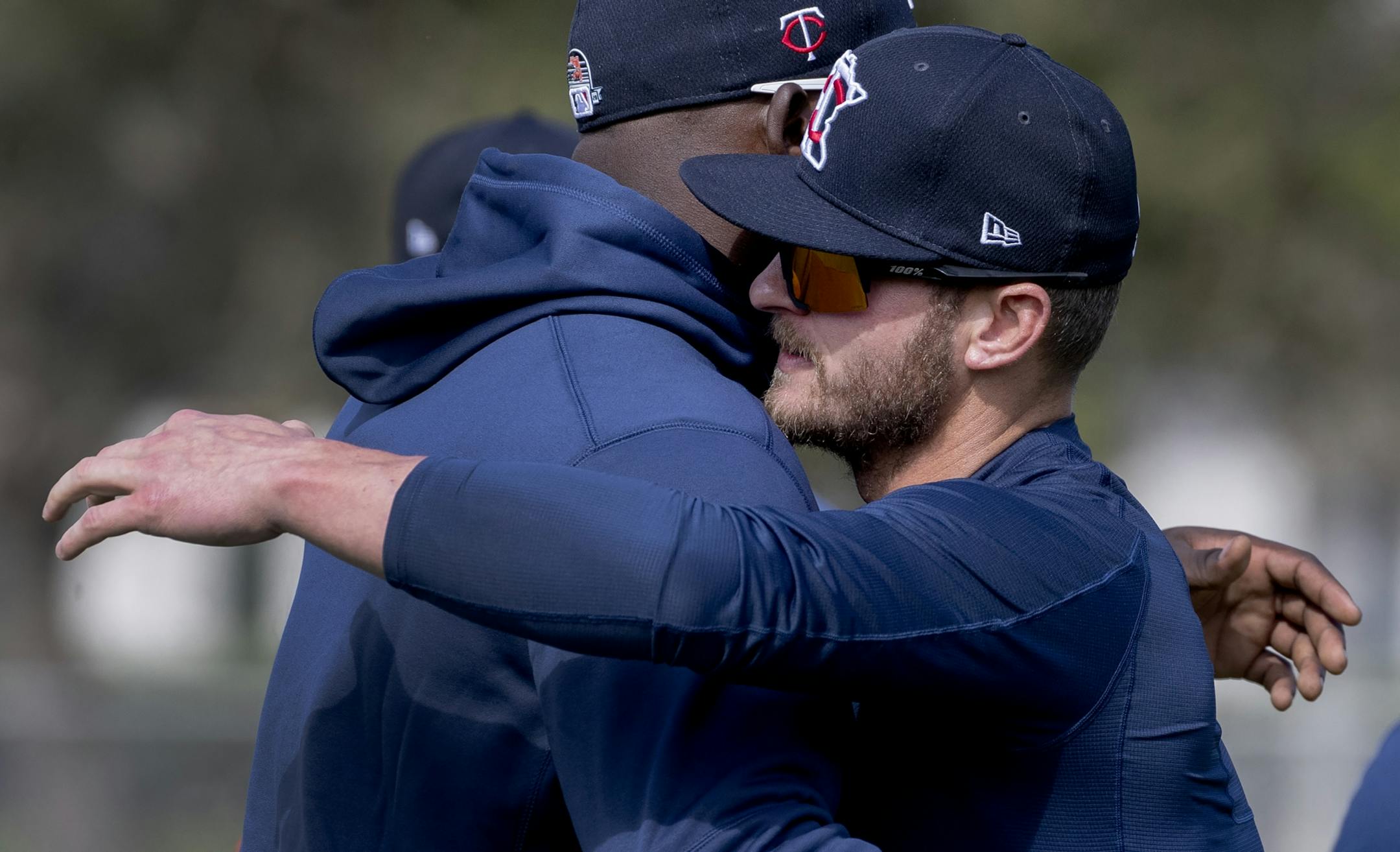 Minnesota Twins' Miguel Sano and Josh Donaldson greeted each other on the first day of practice for position players.