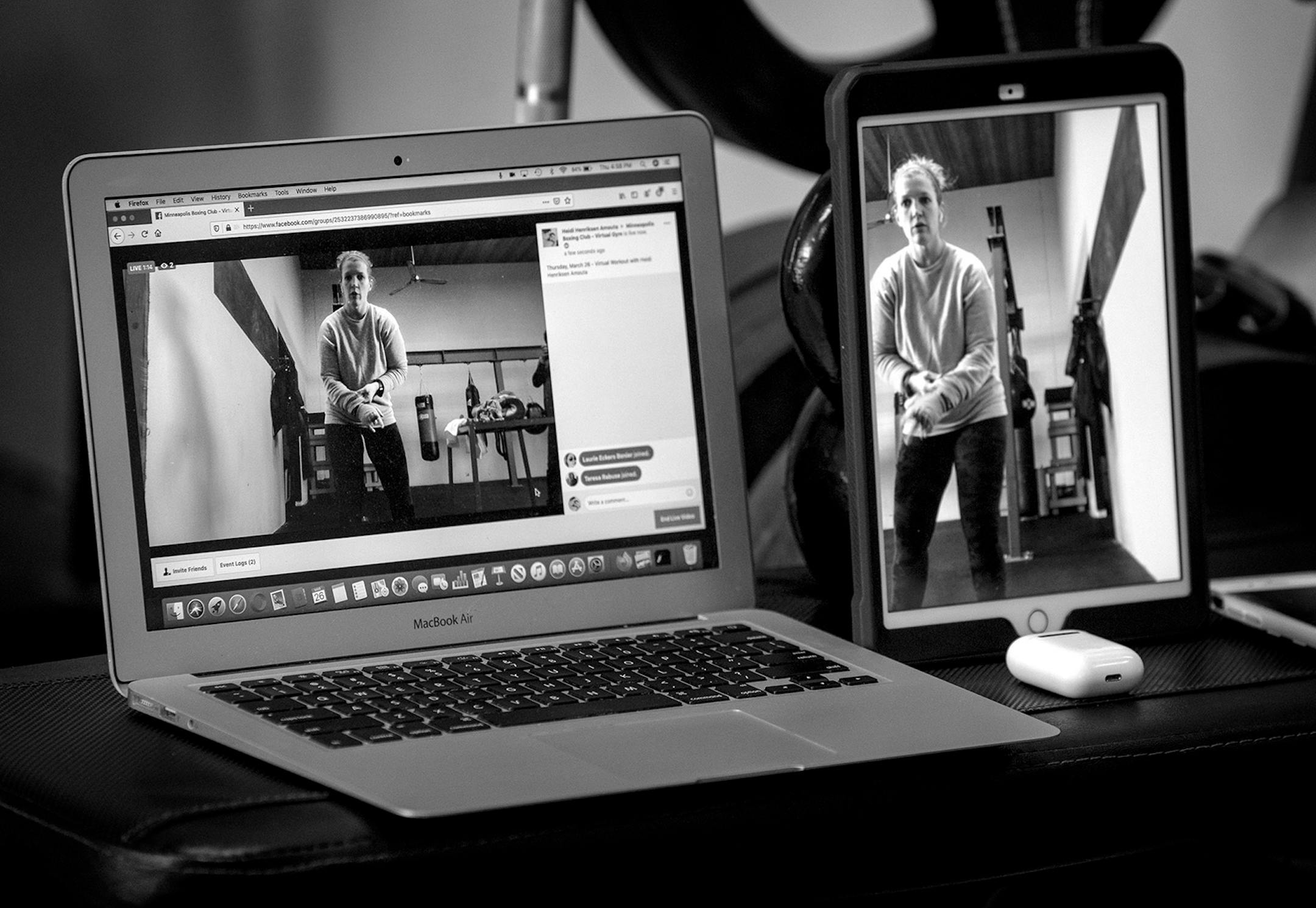 Heidi Amouta prepared to teach a virtual gym group boxing and strength conditioning via a computer at The Minneapolis Boxing Club. Amouta and her husband Joe own the Minneapolis Boxing Club.