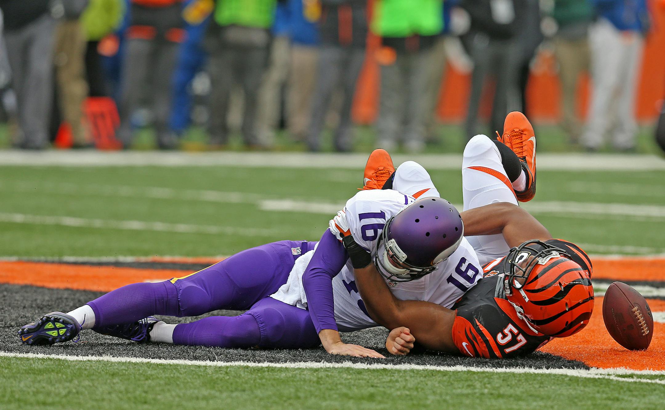Minnesota Vikings quarterback Matt Cassel (16) fumbled the ball as Cincinnati Bengals middle linebacker Vincent Rey (57) took him down in the first quarteras the Minnesota Vikings took on the Cincinnati Bengals at Paul Brown Stadium in Cincinnati, OH, Sunday, December 22, 2013. ELIZABETH FLORES/STAR TRIBUNE) ELIZABETH FLORES • eflores@startribune.com