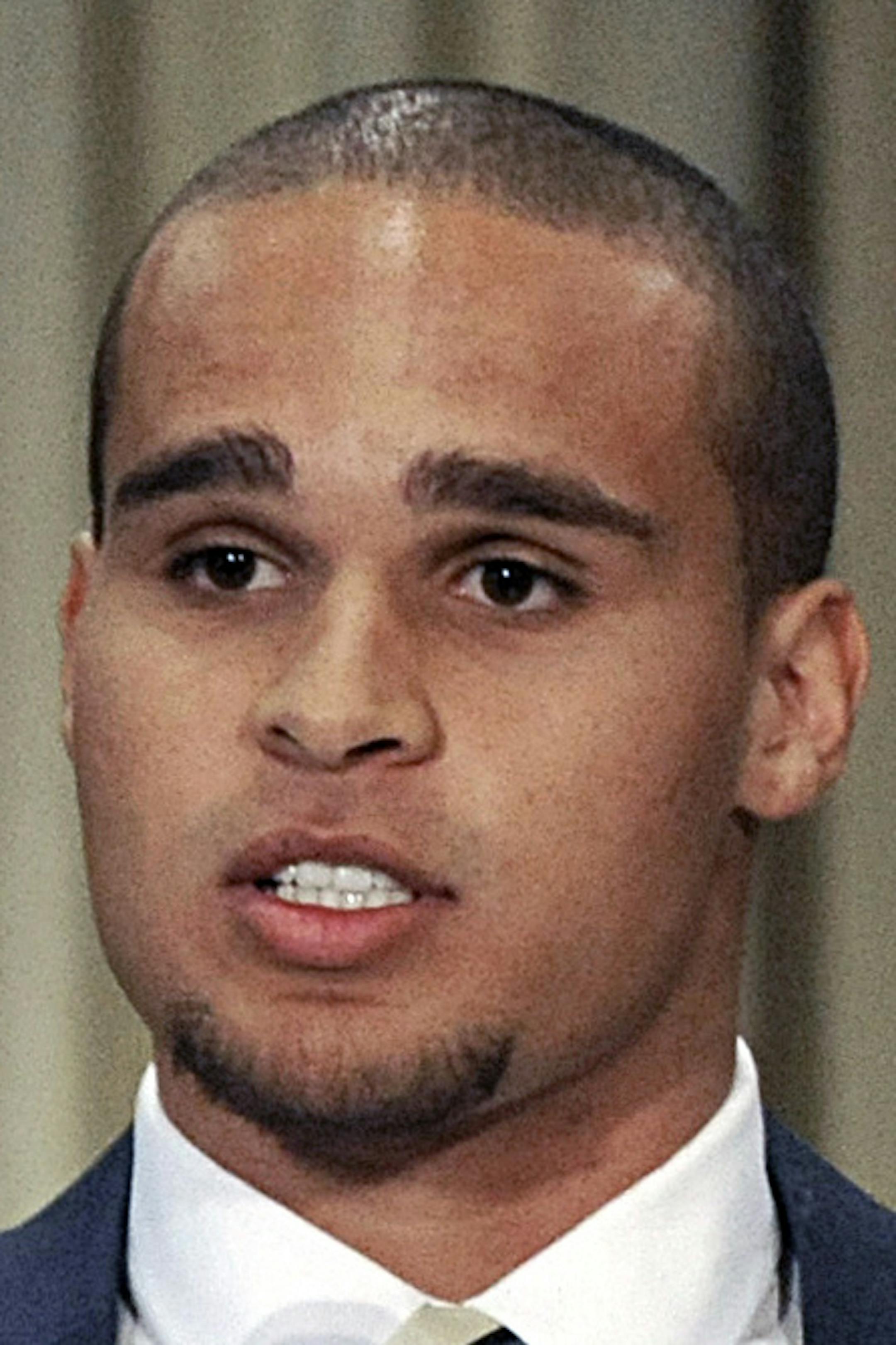 Northwestern quarterback Kain Colter second from right, speaks while College Athletes Players Association president Ramogi Huma left, United Steel Workers National Political Director Tim Waters second from left, and United Steel Workers president Leo Gerard right, look on during a news conference in Chicago, Tuesday, Jan. 28, 2014. Calling the NCAA a "dictatorship," a handful of Northwestern football players announced they are forming the first labor union for college athletes--one they hope wil