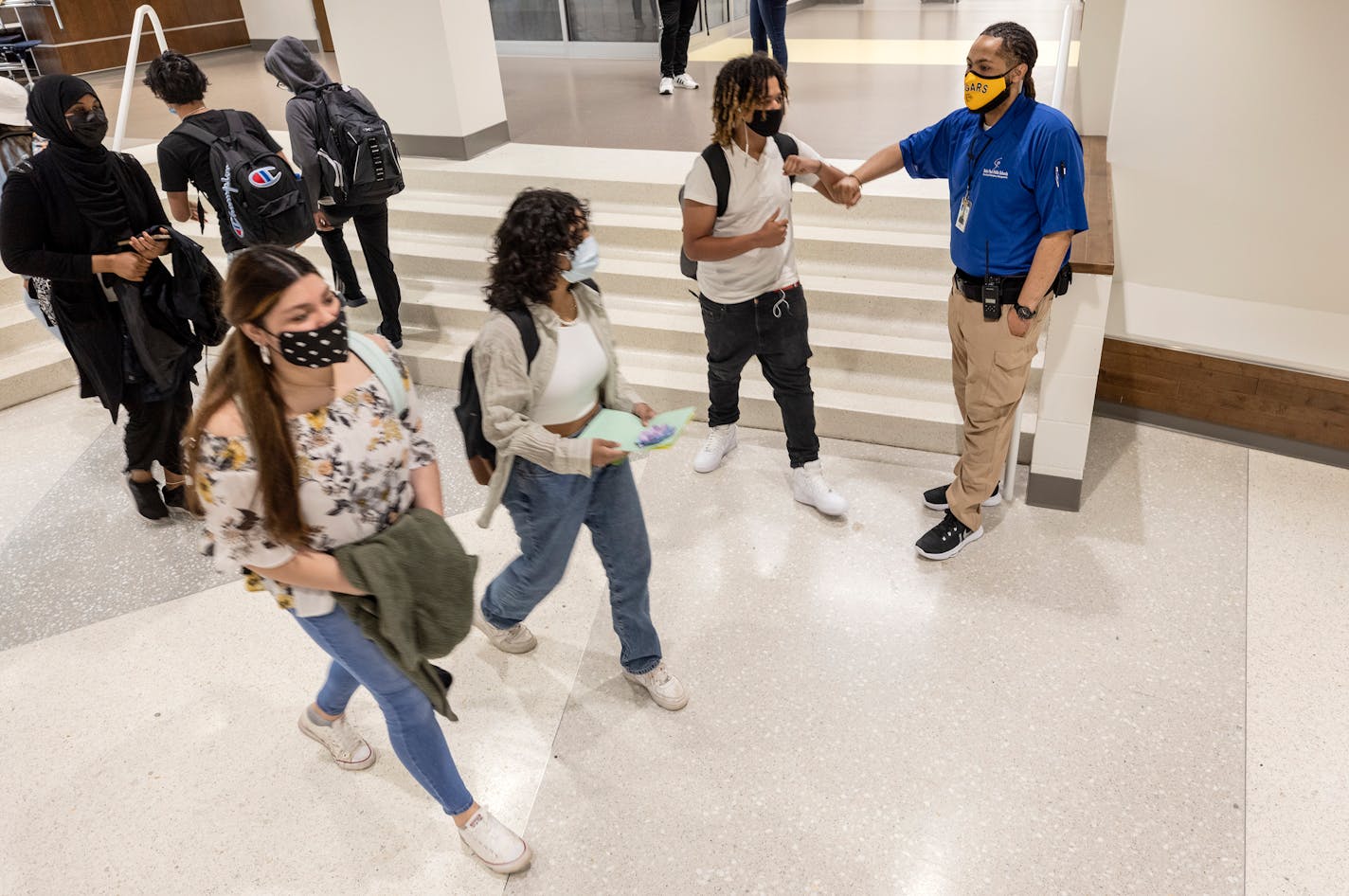 Shaun Ross, SSL at Como Park Senior High School greeted a student in the hall.