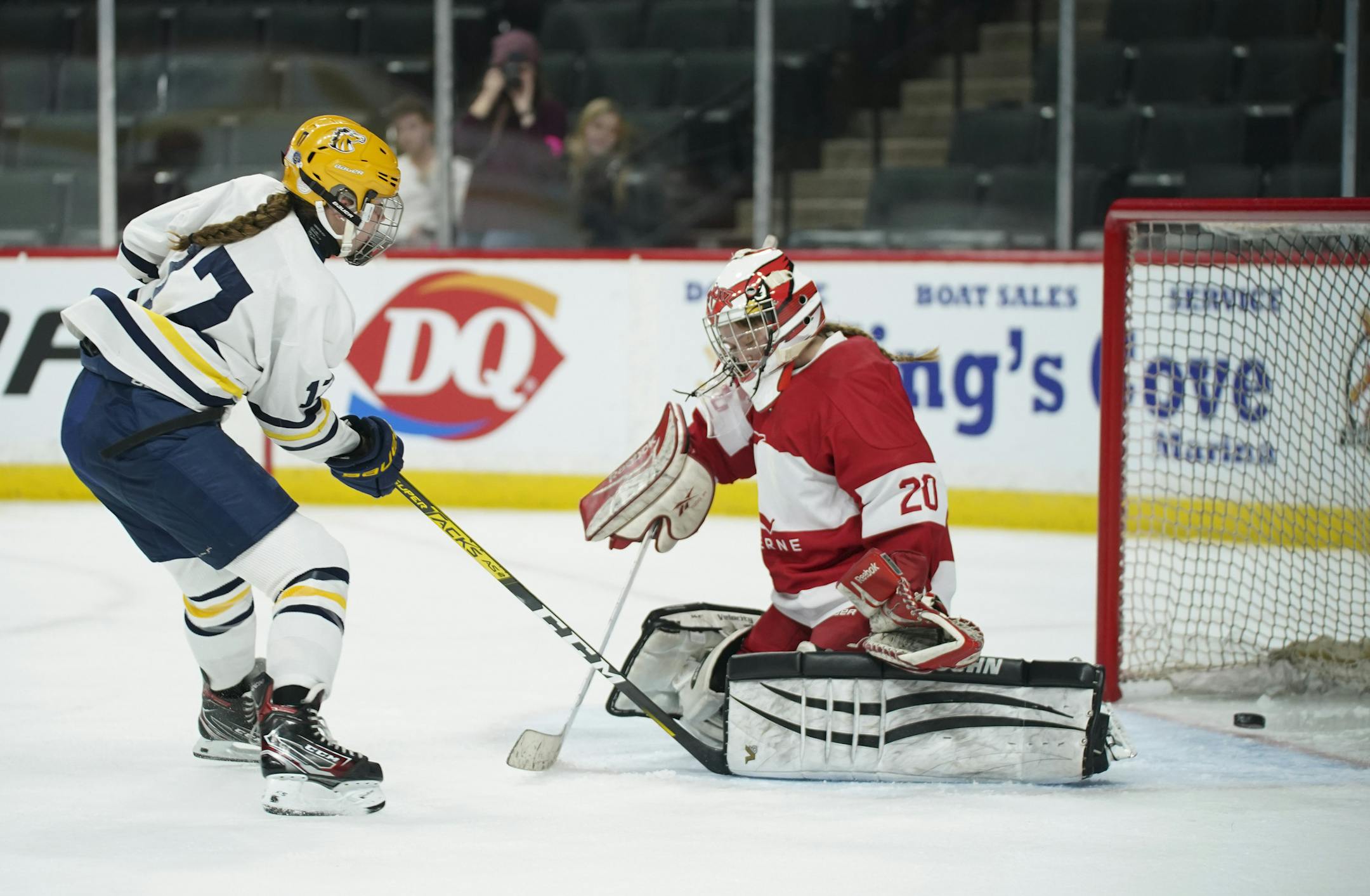 Breck's Olivia Mobley (17) slipped the puck between the pads of Luverne Cardinals golaie Cheyenne Schutz in the first period Wednesday in the Class 1A quarterfinal. Photo: JEFF WHEELER * Jeff.Wheeler@startribune.com The Breck Mustangs faced the Luverne Cardinals in a MSHSL Girls' Hockey State Tournament Class A quarterfinal game Wednesday night, February 19, 2020 at Xcel Energy Center in St. Paul.