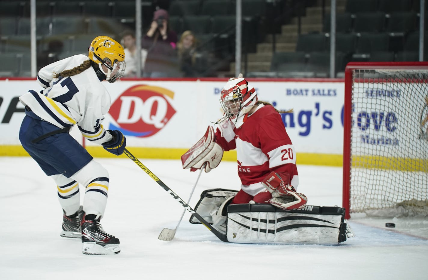 Breck's Olivia Mobley (17) slipped the puck between the pads of Luverne Cardinals golaie Cheyenne Schutz in the first period Wednesday in the Class 1A quarterfinal. Photo: JEFF WHEELER * Jeff.Wheeler@startribune.com The Breck Mustangs faced the Luverne Cardinals in a MSHSL Girls' Hockey State Tournament Class A quarterfinal game Wednesday night, February 19, 2020 at Xcel Energy Center in St. Paul.