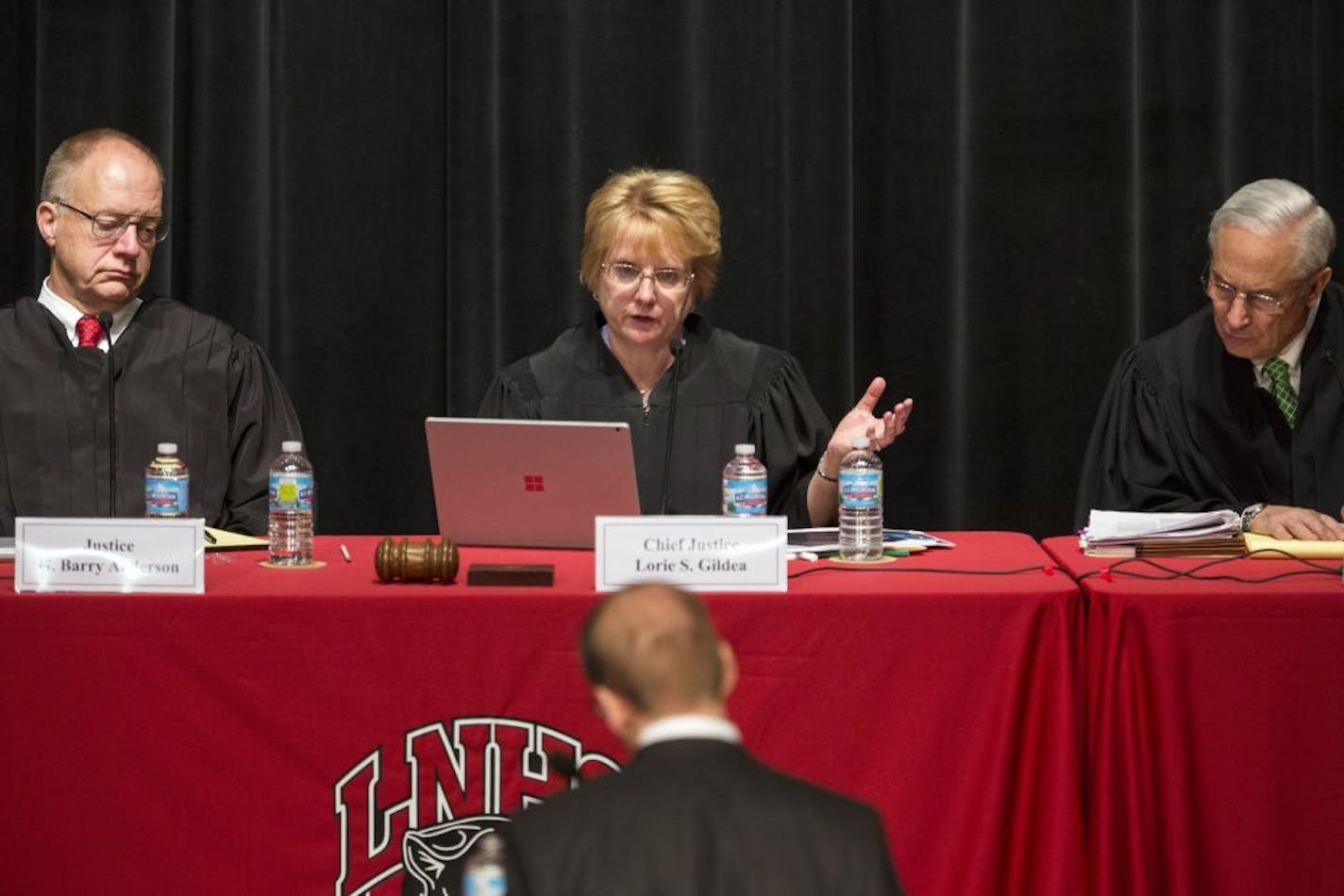 Minnesota Supreme Court Associate Justice G. Barry Anderson, from left, Chief Justice Lorie Skjerven Gildea and Associate Justice Christopher Dietzen hear arguments at Lakeville North High School.