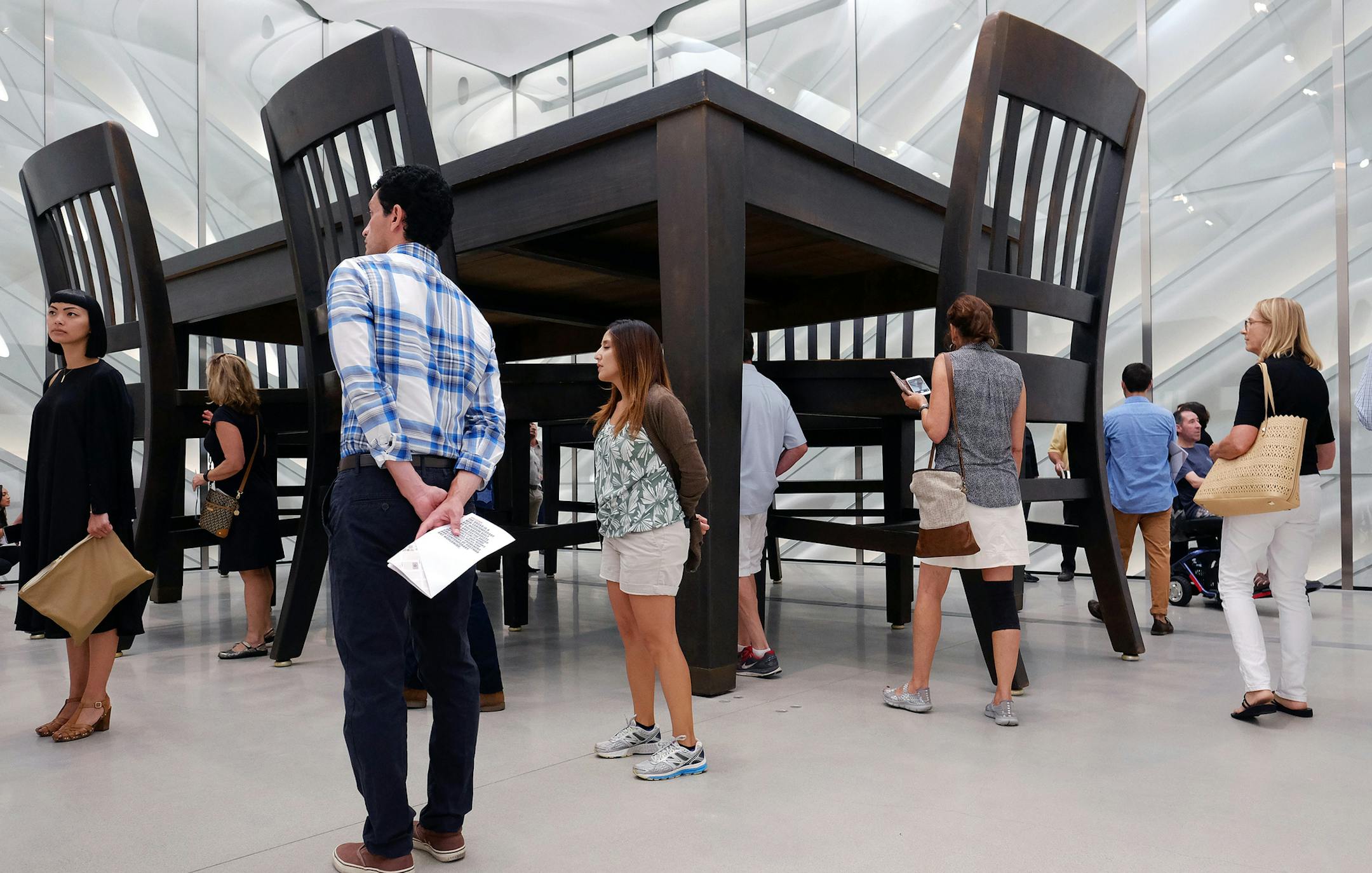 Visitors view Robert Therrien's "Under the Table," at the The Broad, a pop-art styled museum on its first day open to the public Sunday, Sept. 20, 2015, in downtown Los Angeles. The $140 million project featuring 50,000 square feet of exhibition space is the most recent accomplishment in Eli Broad's ongoing effort to remake a once seedy section of downtown Los Angeles into the cultural arts center he has long envisioned. (AP Photo/Richard Vogel) ORG XMIT: LA108