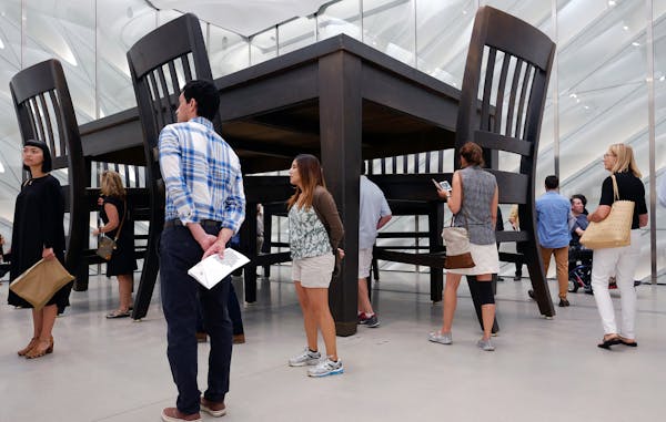 Visitors view Robert Therrien's "Under the Table," at the The Broad, a pop-art styled museum on its first day open to the public Sunday, Sept. 20, 201