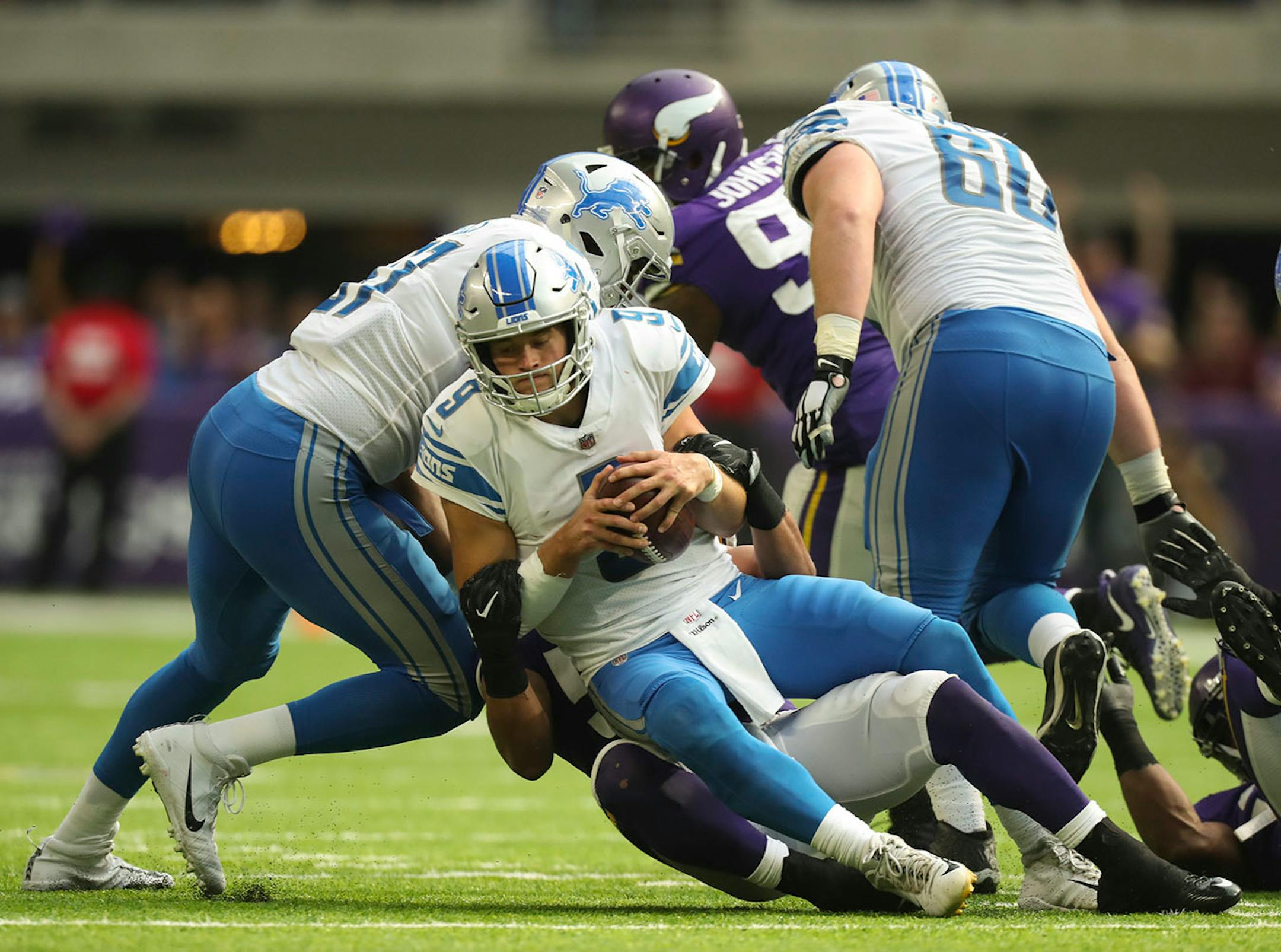 Detroit Lions quarterback Matthew Stafford (9) was sacked for a four yard loss by Minnesota Vikings middle linebacker Eric Kendricks (54) in the fourth quarter.