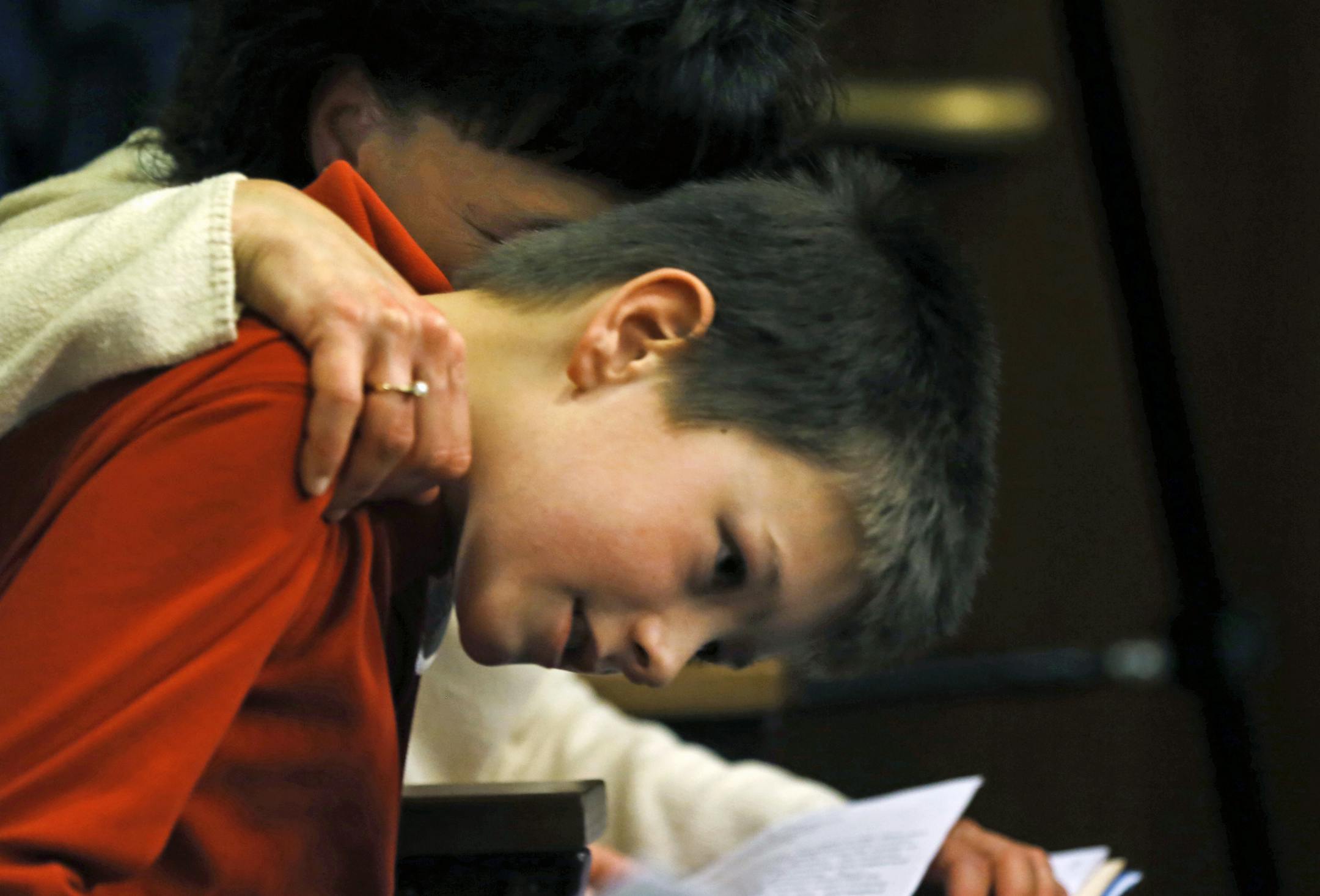 Jake Ross, 10, of Forest Lake, told of how he was bullied at a charter school when he was 7. “I’m going to kill you,” Jake remembered the bully telling him. With Jake as he testified Thursday was his mother.