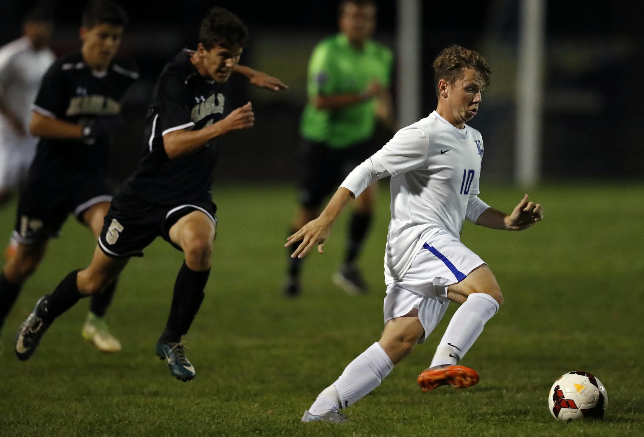 Zack Aday-Nicholson(10) is chased by Jake Schumacher(5) of Apple Valley.] Eastview's boys' soccer team will be hosting Park of Apple Valley at the high school. Richard Tsong-Taatarii/Richard.tsong-taatarii@startribune.com