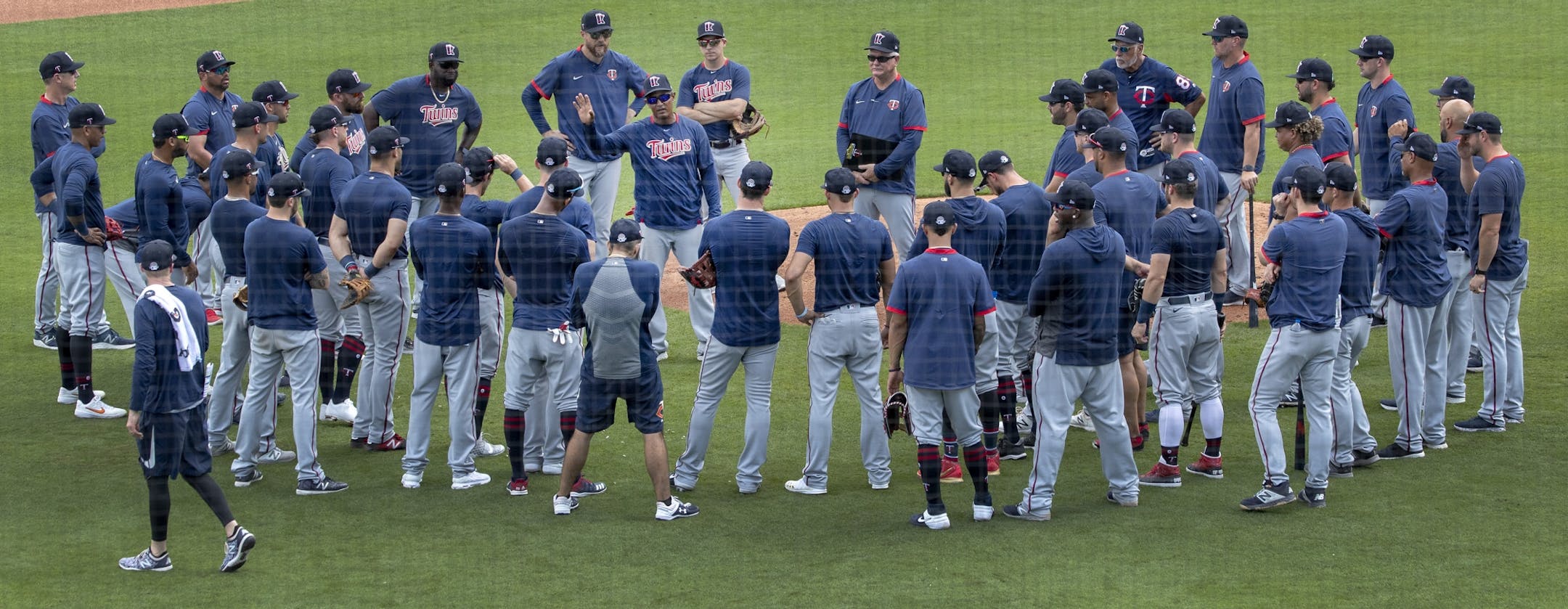 Minnesota Twins coach Tony Diaz went over signs with players on Thursday.