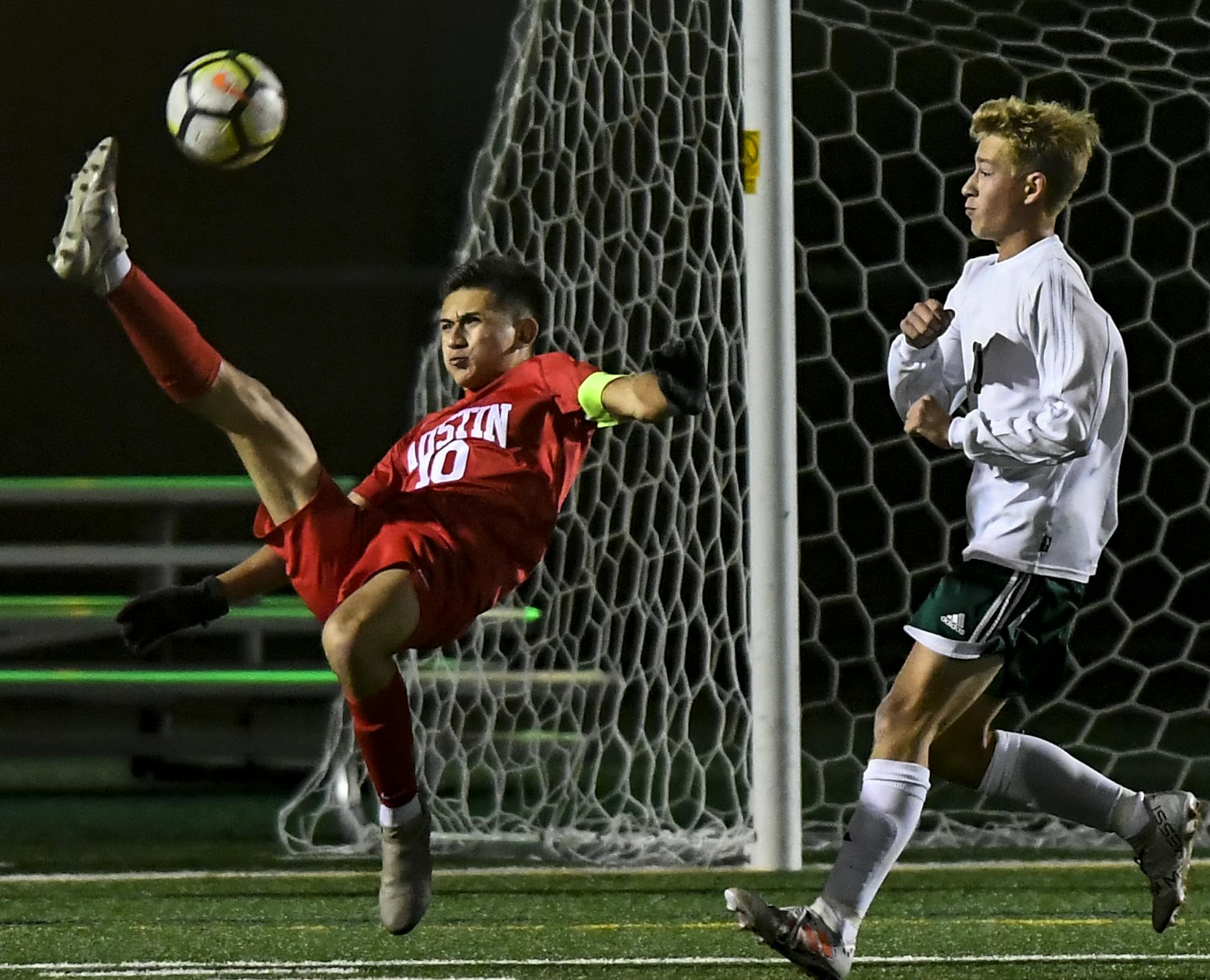 Austin midfielder Kevin Ortiz (10) attempted a bicycle kick against Holy Family's goal in the first half. ] Aaron Lavinsky • aaron.lavinsky@startribune.com Austin played Holy Family in a Class 1A boys' quarterfinal soccer game on Wednesday, Oct. 24, 2018 at Prior Lake High School in Savage, Minn.