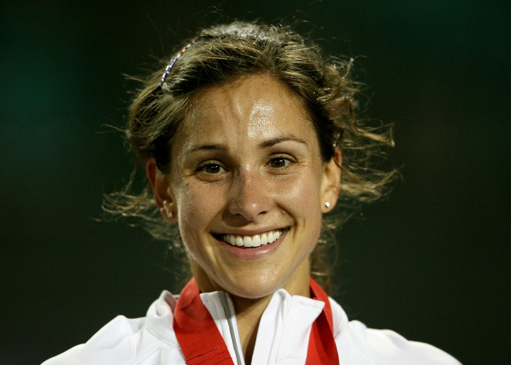 EUGENE, OR - JUNE 27: Kara Goucher smiles from the podium after receiving the silver medal in the women's 10,000 meter final during day one of the U.S. Track and Field Olympic Trials at Hayward Field on June 27, 2008 in Eugene, Oregon. Goucher along with Shalane Flanagan and Amy Begley finished in the top three and will be competing for the United States at the Olympic Games in Beijing, China.