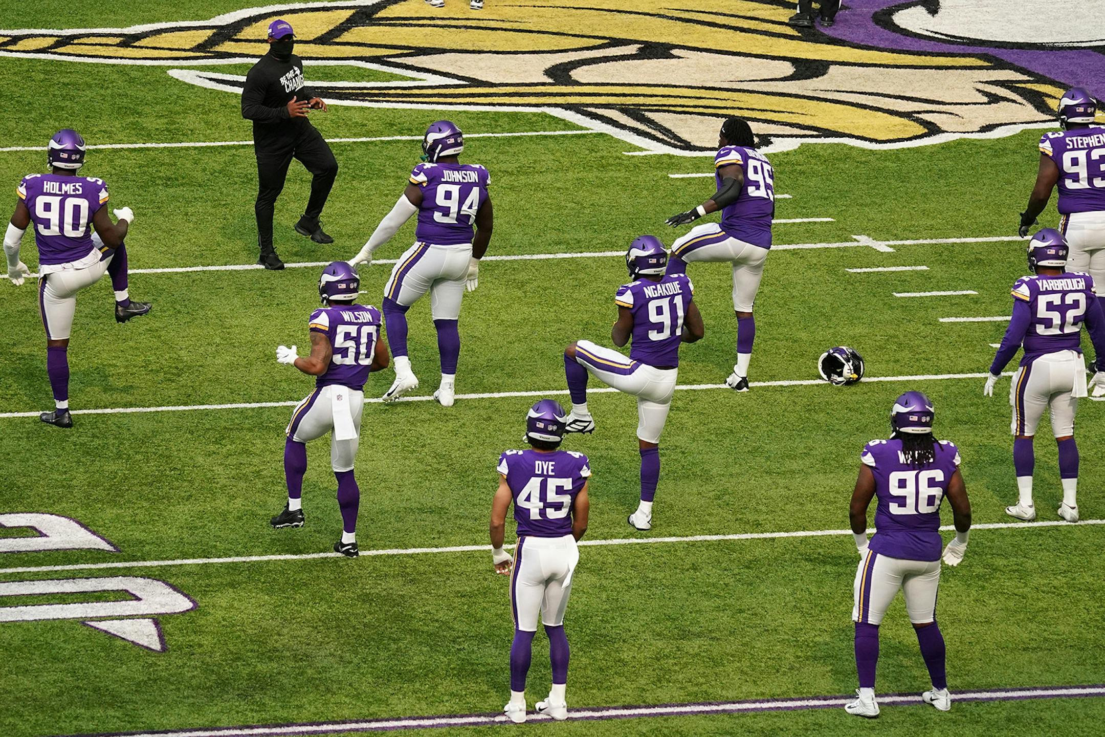 Minnesota Vikings players stretched on the field ahead the game against the Green Bay Packers.