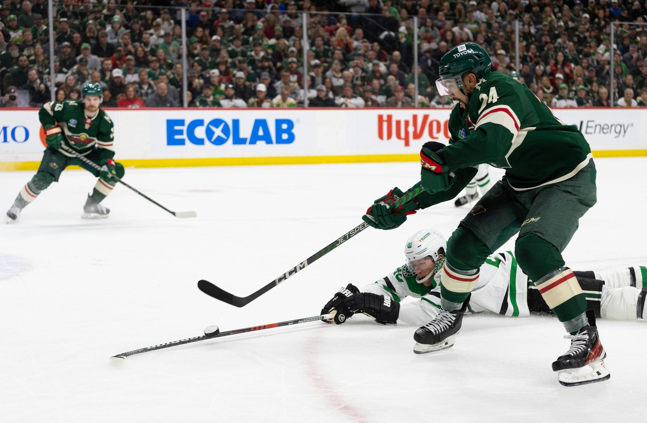 Minnesota Wild defenseman Matt Dumba (24) lifted a pass over the stick of Dallas Stars defenseman Ryan Suter (20) in the second period.