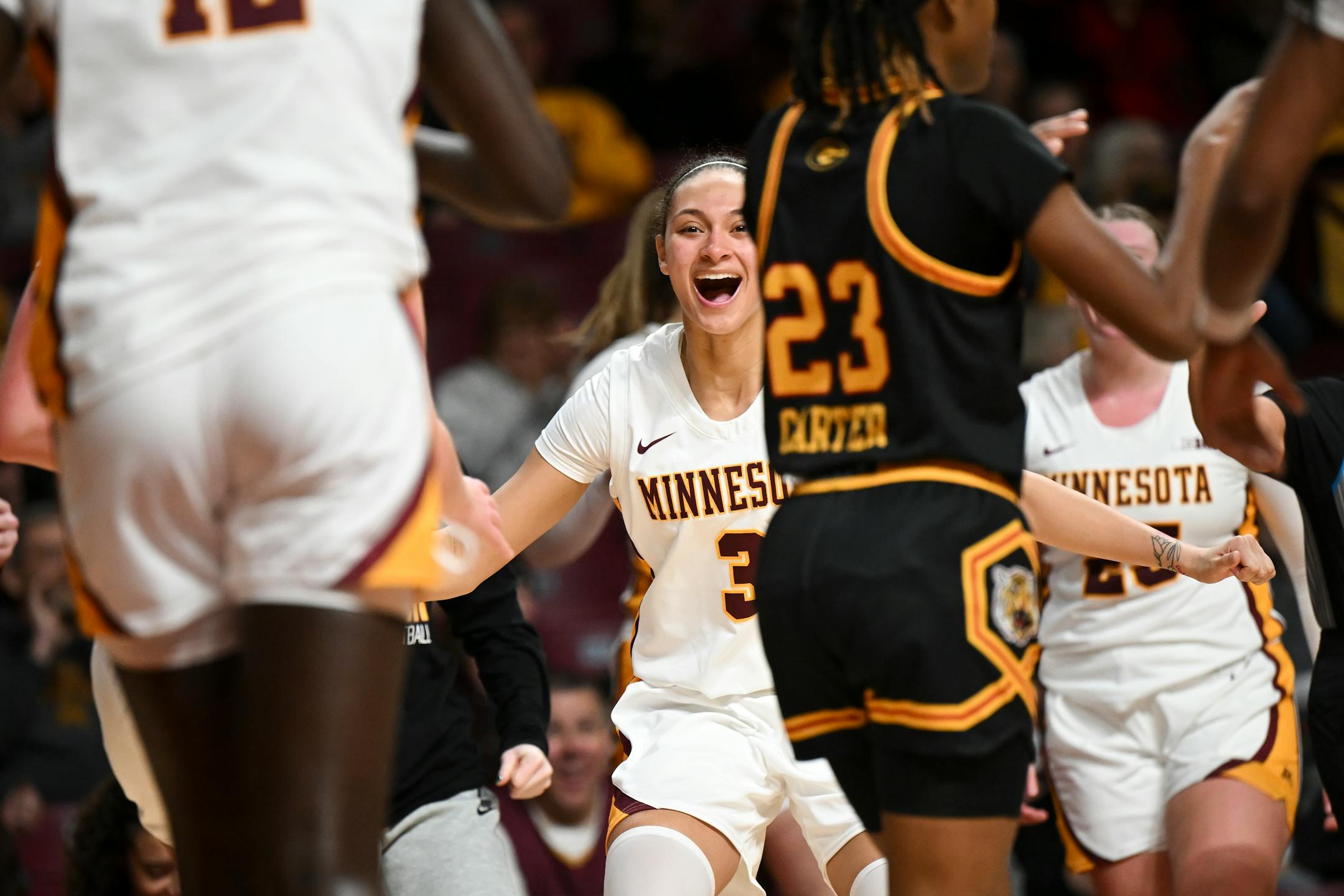 Minnesota Gophers guard Amaya Battle (3) celebrates with guard Ajok Madol (12) after an and-one opportunity earned by Madol in the second half.
