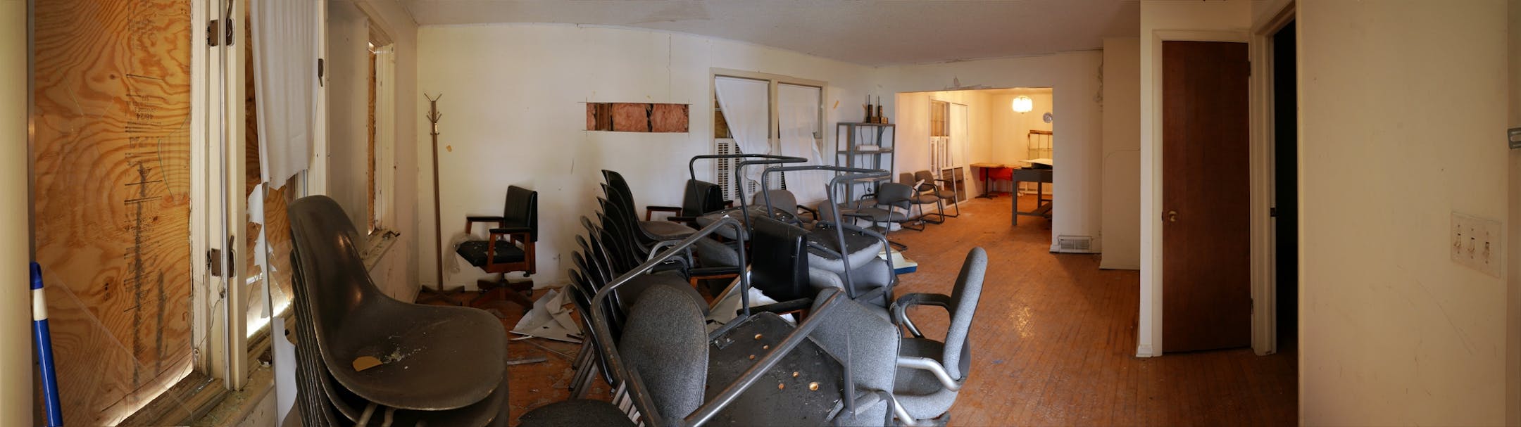 A panoramic photo combining 11 individual frames into one gives a view of the interior of the 1902 Section Foreman House, a possible candidate for the National Register of Historic Places where the railroad foreman used to live, Thursday in Wayzata. The dilapidated building contains mostly surplus office furniture.
