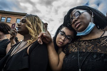 Mourners stood outside to hear a broadcast of Thursday's memorial service for George Floyd. Hundreds stood outside the service at North Central Univer