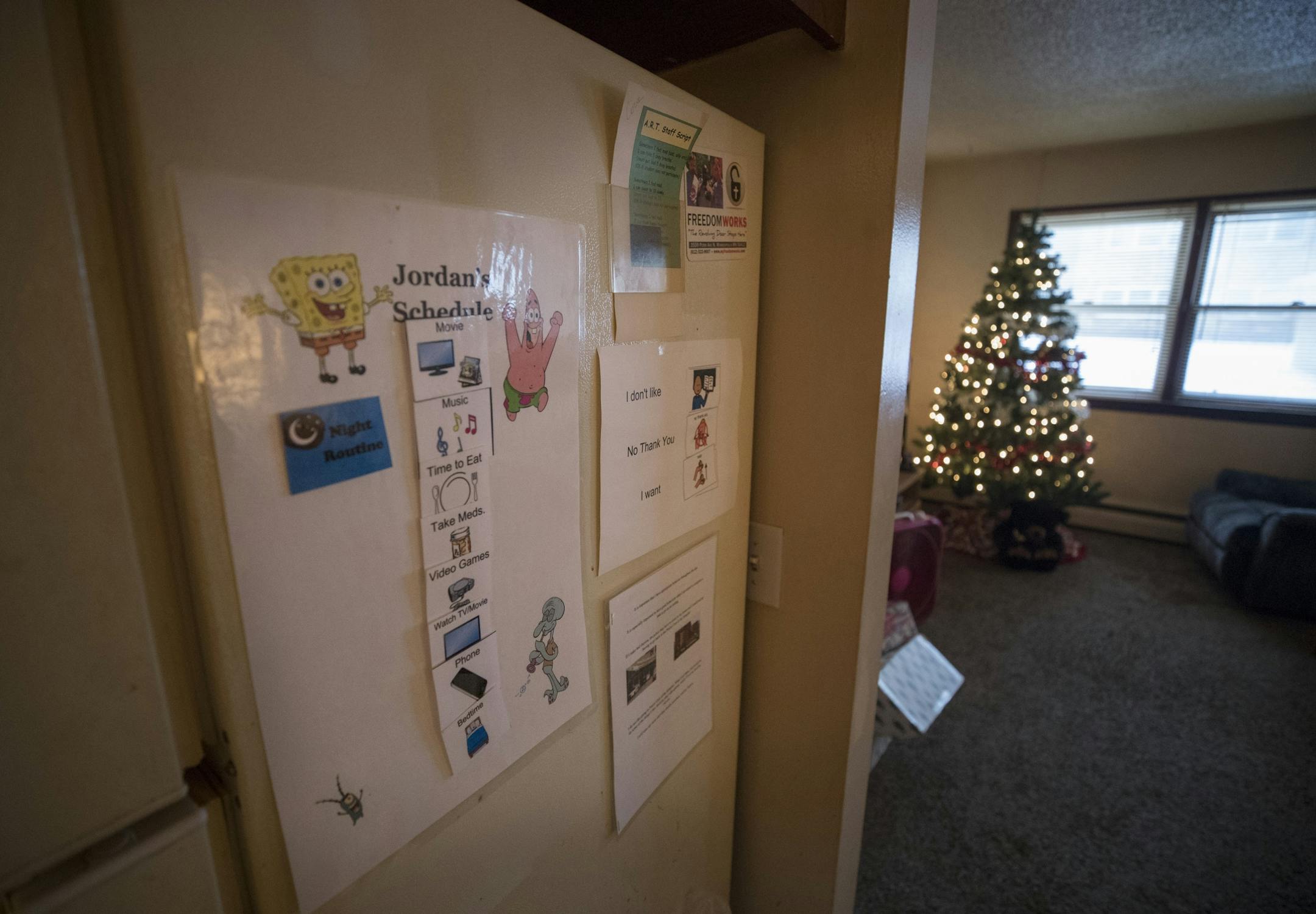 Jordan Mustin schedule on the refrigerator Thursday December 14, 2017 in Mounds View, MN. Jordan has autism and a history of violent outbursts toward himself and family.
