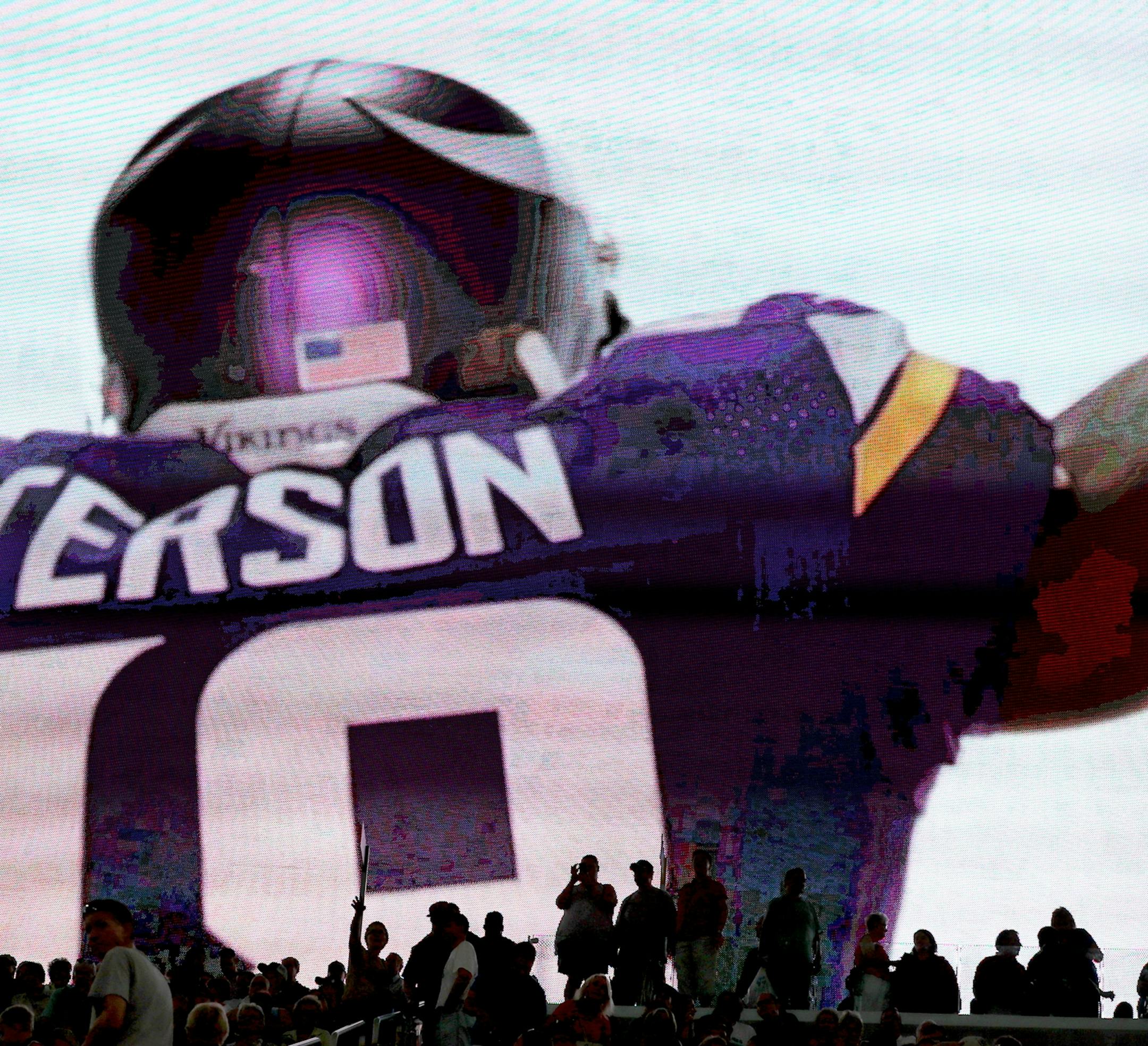 On a giant video monitor, Minnesota Vikings running back Adrian Peterson is seen on a highlight reel at the new U.S. Bank Stadium during an open house for the public Saturday, July 23, 2016, in Minneapolis, MN.