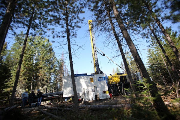 In this file photo, a drill rig digging for Twin Metals was working in the woods near Ely, Minn.