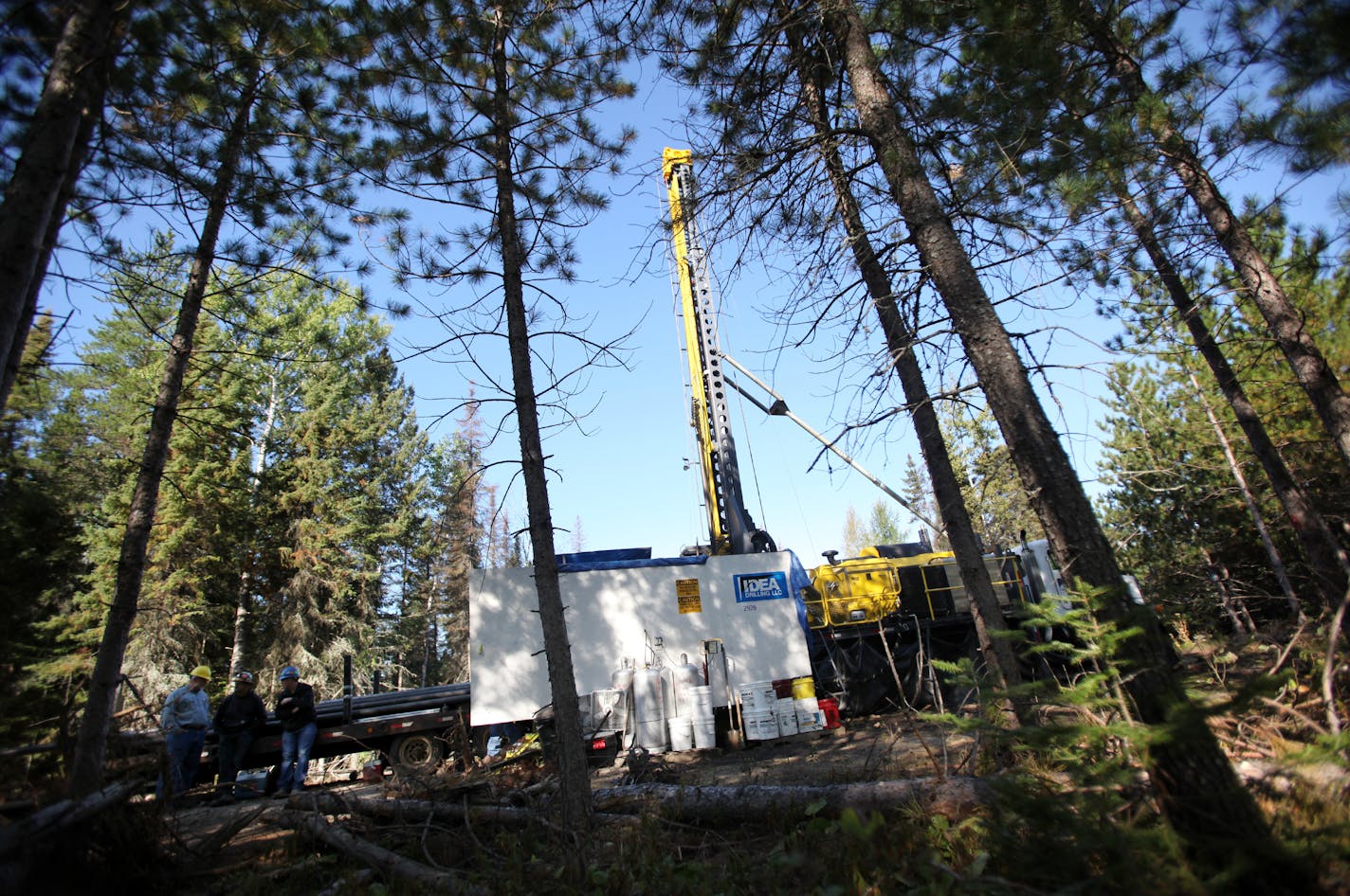 In this file photo, a drill rig digging for Twin Metals was working in the woods near Ely, Minn.