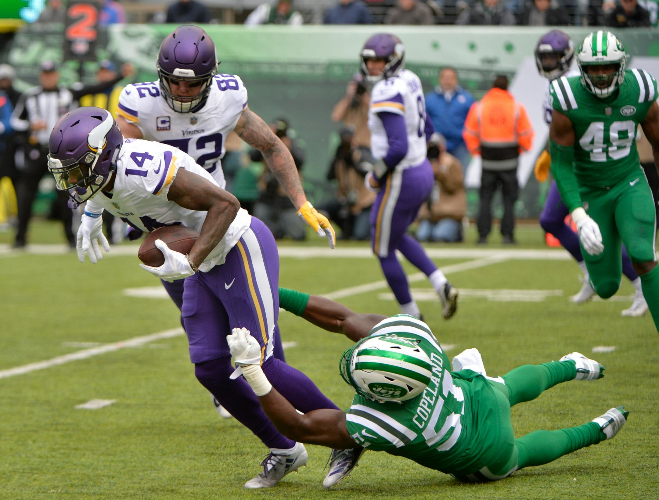 New York Jets outside linebacker Brandon Copeland tackles Vikings wide receiver Stefon Diggs