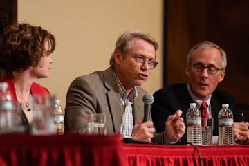 State Rep. Raymond Dehn, center, spoke at Wednesday night's mayoral election forum. Sitting besides him are incumbent Mayor Betsy Hodges and candidate