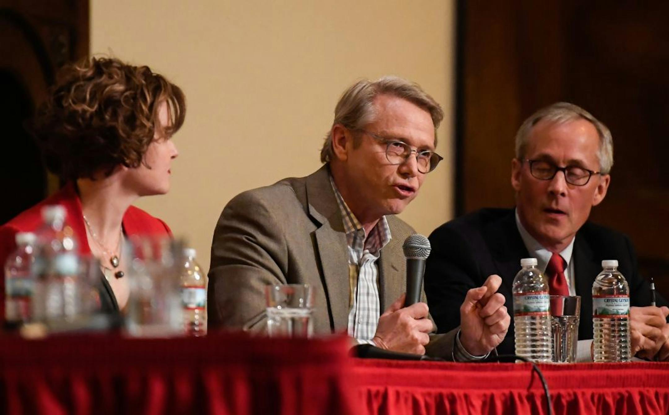 State Rep. Raymond Dehn, center, spoke at Wednesday night's mayoral election forum. Sitting besides him are incumbent Mayor Betsy Hodges and candidate Tom Hoch.