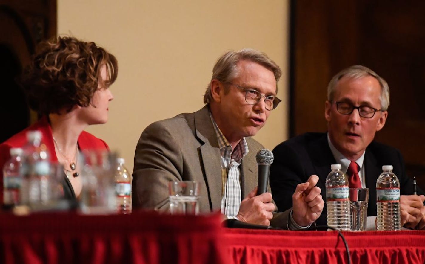 State Rep. Raymond Dehn, center, spoke at Wednesday night's mayoral election forum. Sitting besides him are incumbent Mayor Betsy Hodges and candidate Tom Hoch.