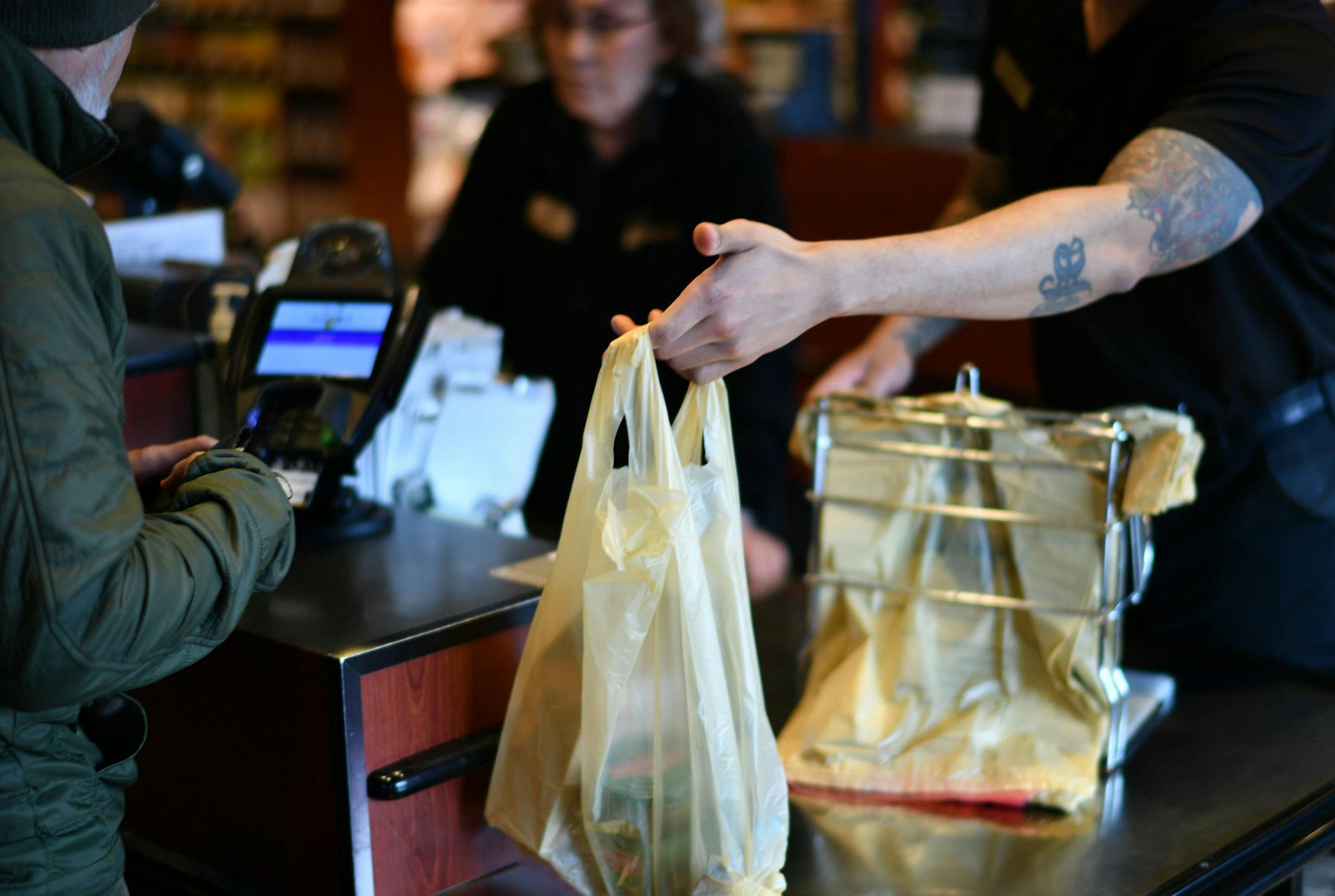 Justin Marshall bagged customers groceries at Kowalski's in Southwest Minneapolis. Kowalski's customers are given a choice of paper or plastic grocery bag. Many choose both depending on their purchased item and many bring their own reusable bags. ] GLEN STUBBE &#x2022; glen.stubbe@startribune.com Thursday, March 9, 2017 Kowalski's is one of the stores that was opposed to Minneapolis' plastic bag ban and has continued to oppose it in the Legislature. A handful of bills being considered at the Cap