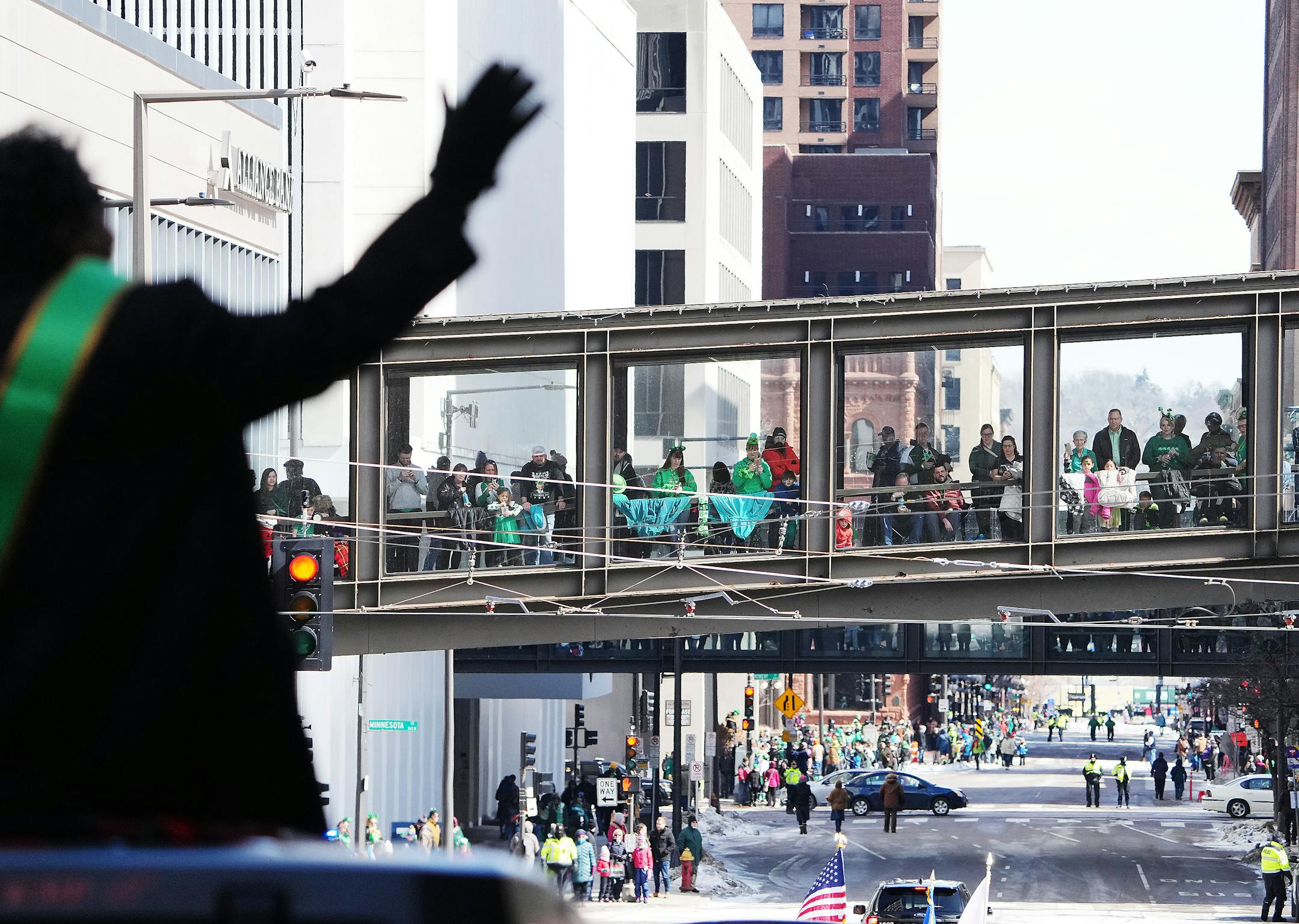 Parade goers in a skywalk stayed warm while watching Fancy Ray, Celebrity Grand Marshal.