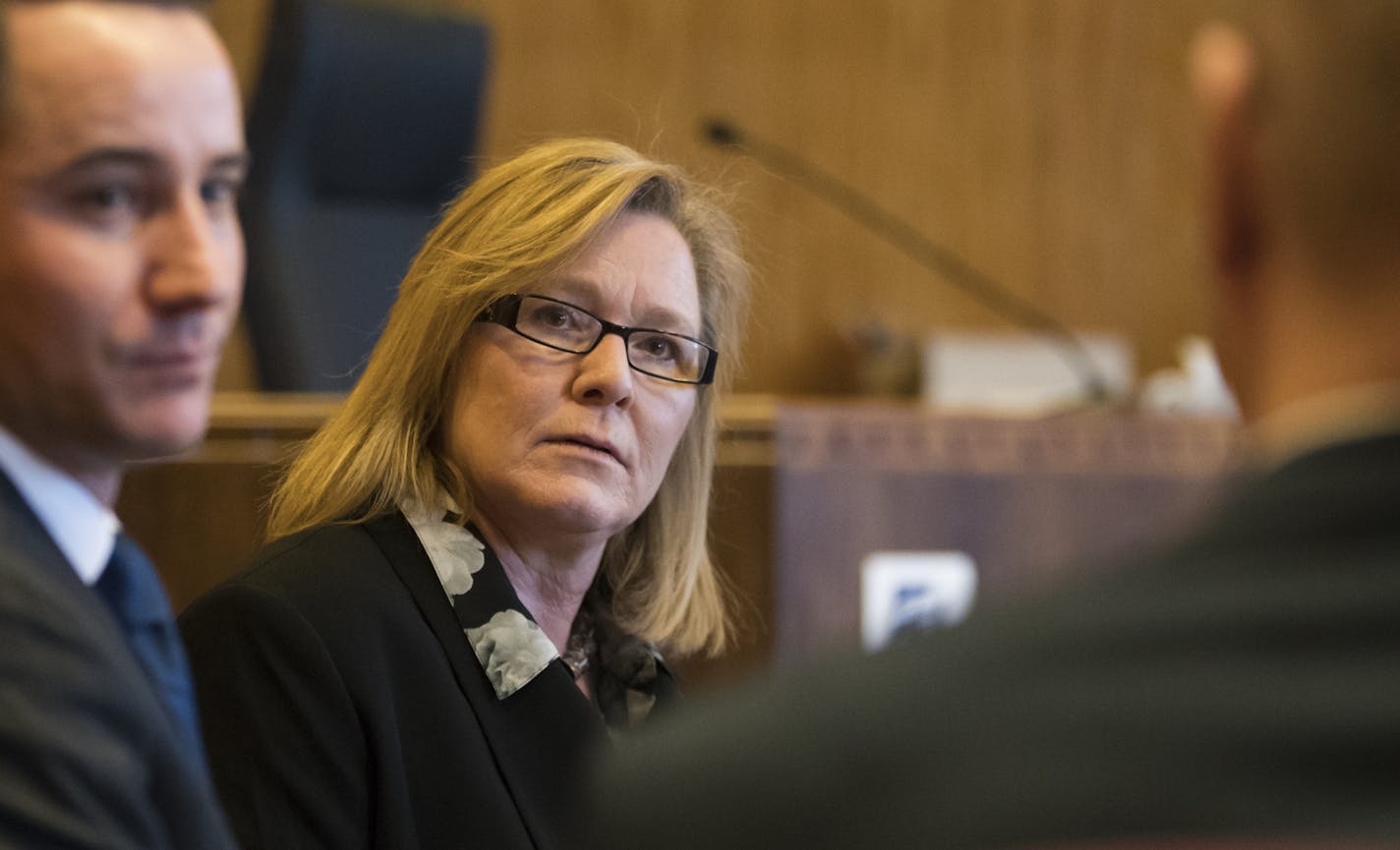 Lt. Gov. Michelle Fischbach chatted with her lawyers before a motion hearing in the civil lawsuit by constituent Destiny Dusosky claiming Lt. Gov. Michelle Fischbach should give up her Senate seat after becoming Lieutenant Governor when former Lieutenant Governor Sen. Tina Smith was appointed to the U.S. Senate. Photographed on Tuesday, February 6, 2018, at the Ramsey County Courthouse in St. Paul, Minn. ] RENEE JONES SCHNEIDER &#x2022; renee.jones@startribune.com