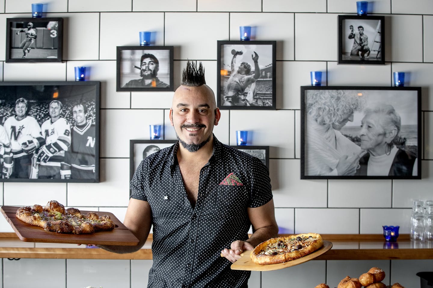 Boludo chef/owner Facundo Javier Defraia photographed at the restaurant with a photo of his mother and grandmother behind him, Thursday, March 7, 2019 in Minneapolis, MN. It is an empanadas/pizza storefront in south Minneapolis.