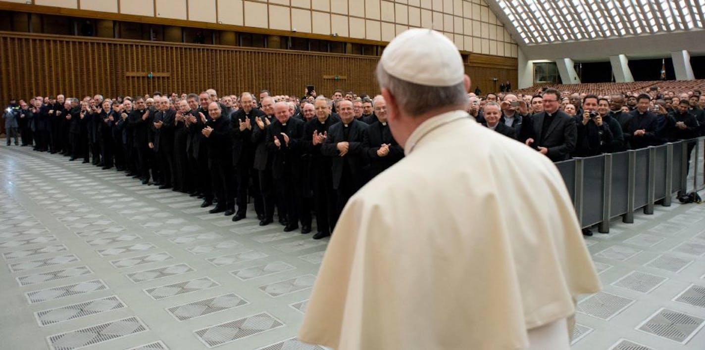 In this picture provided by the Vatican newspaper L'Osservatore Romano, Pope Francis arrives for a meeting with Roman priests at the Vatican, Thursday, March 6, 2014.