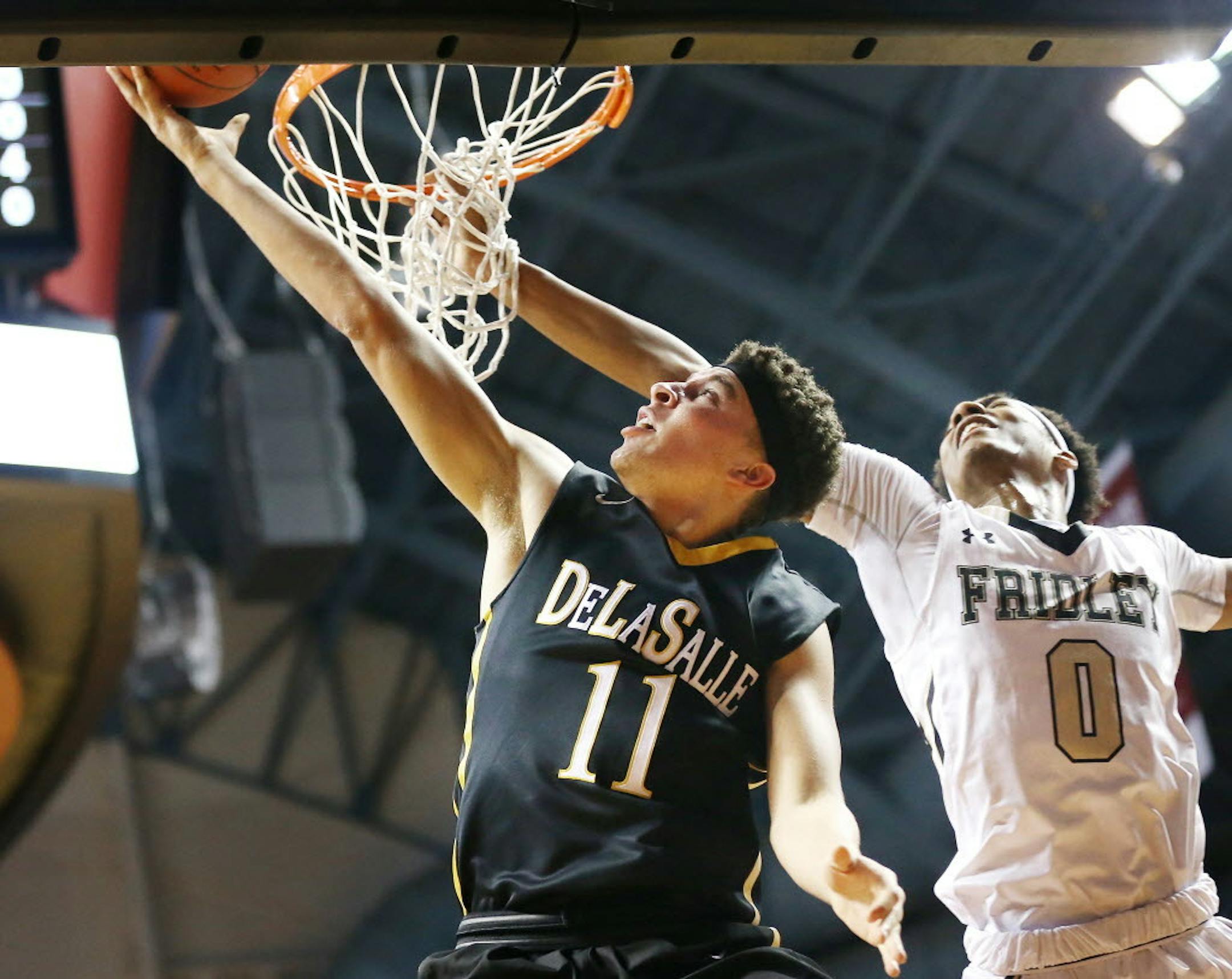 Gabe Kalscheur of DeLaSalle scored on a layup over Shyheem Murray of Fridley at Williams Arena Wednesday March 9, 2016 in Minneapolis. DeLaSalle played Fridley in the 3A quarterfinals at Williams Arena. Jerry Holt/Jerry.Holt@Startribune.com