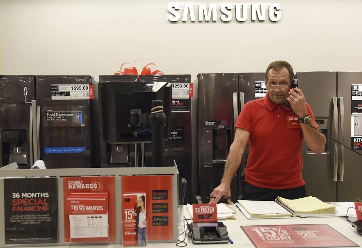 Appliance supervisor Doug Whitfield takes a phone call at JCPenney in Tyler, Texas, Friday Nov. 18, 2016. JCPenney will open Thanksgiving Day at 3 p.m. for their Black Friday sale. The appliance department is new to JCPenney.