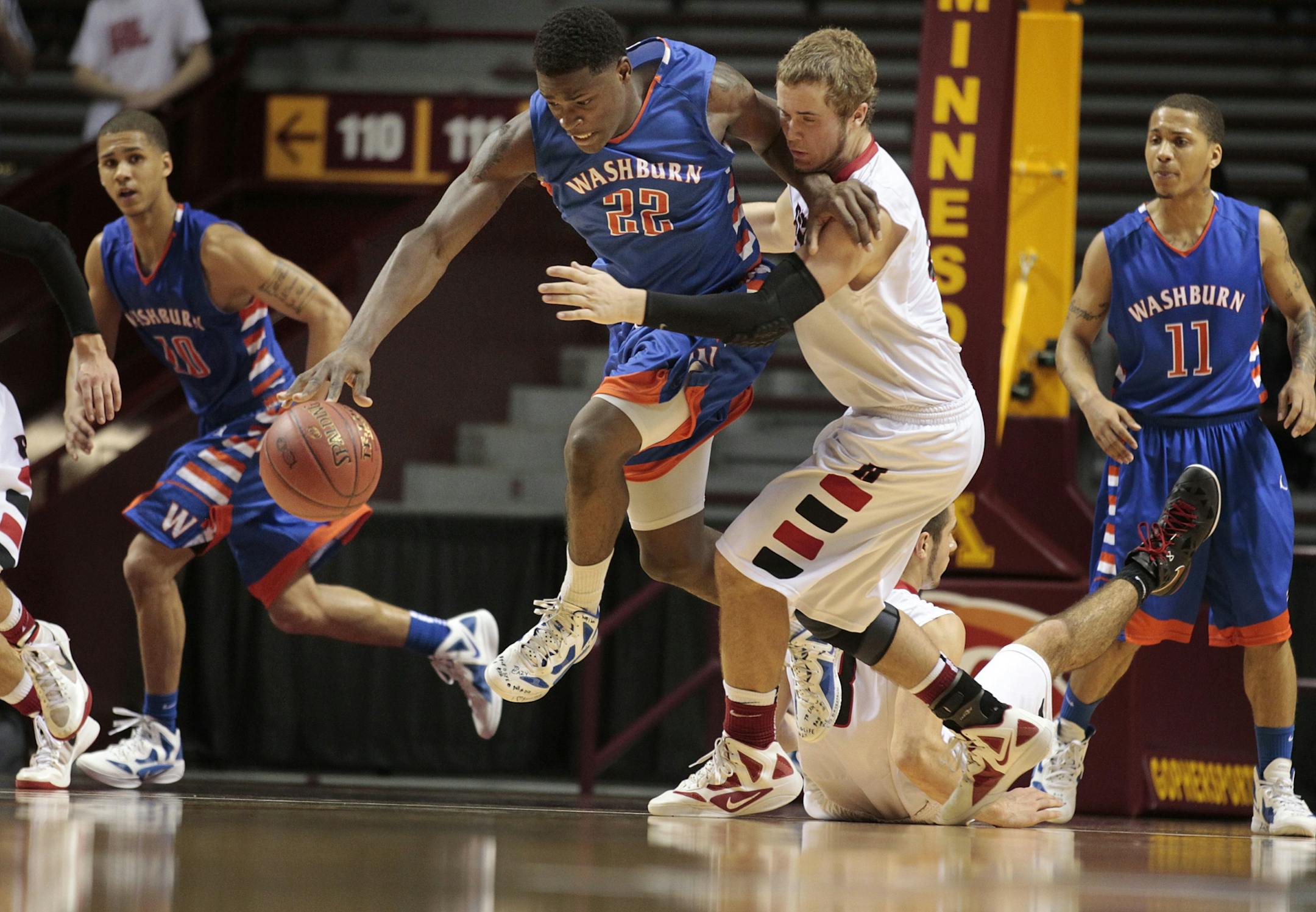 Jerry Pratt of Minneapolis Washburn pushed the ball upcourt against Rocori. Pratt scored six of his 14 points in the last 1:41 of the game. He also had eight rebounds, including seven on the offensive end.
