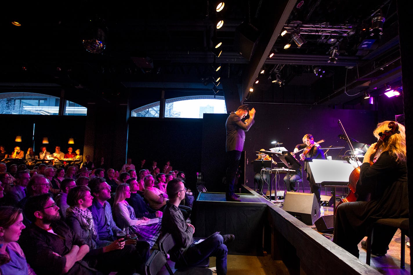 Daniel Bjarnason conducts the musicians of the Minneapolis Music Company at the Amsterdam Bar and Hall in St. Paul May 6, 2014. The event was presented by the Saint Paul Chamber Orchestra's Liquid Music Series. (Courtney Perry/Special to the Star Tribune)